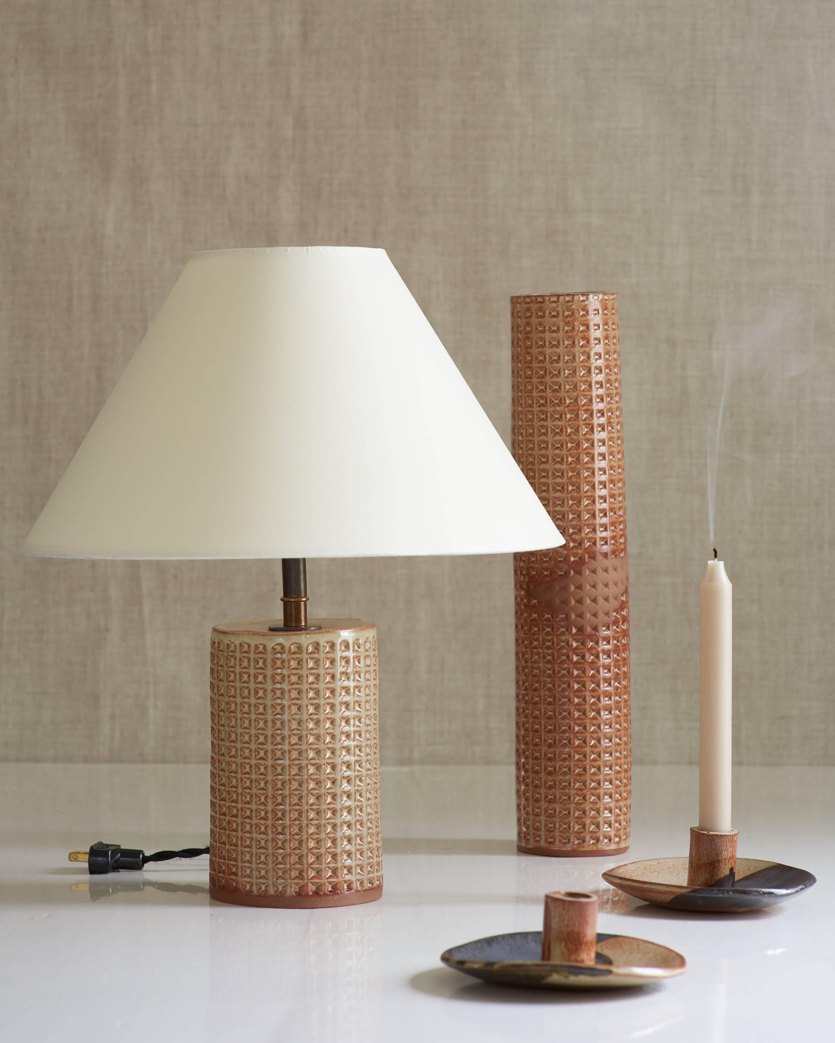 Handmade stoneware slab construction with waffle texture. Lamps are individually crafted and one of a kind.

Ochre glaze with waffle texture. Antique brass fittings with braided black silk cord and off-white paper shade.

Column Height 8”
Column