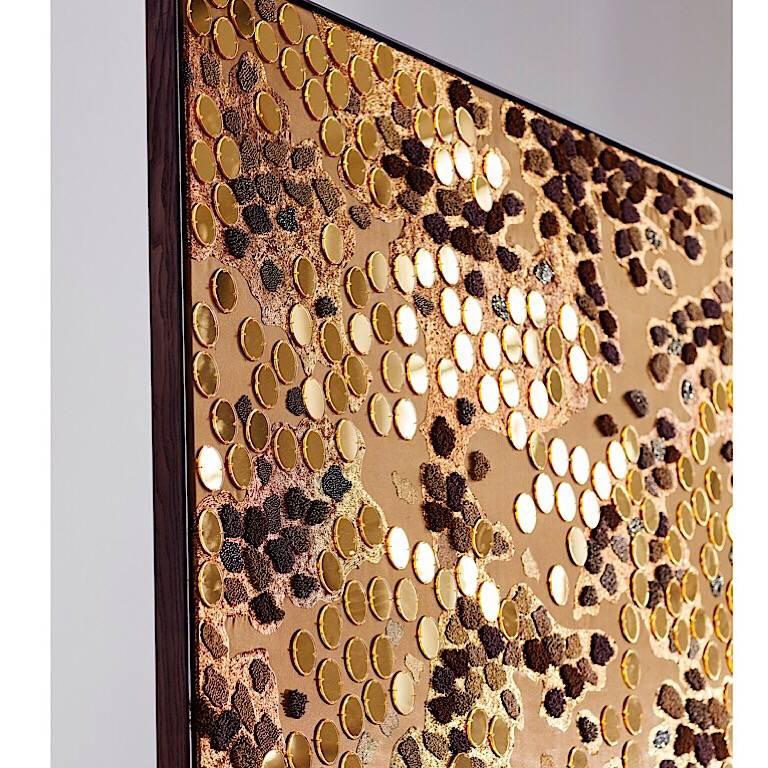 Geraldine Larkin hand embroidered fibre art Gold plexi mirrors and gold work of bullion beads and French knots.
Inspired by the pebbles on a lakeshore the light reflects and mirrors its surrounding
Many shades of gold glisten like an afternoon