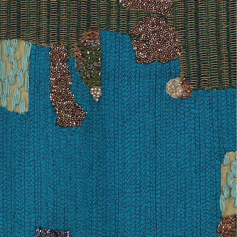 The hand embroidery includes woollen french knots, raffia yarns,cotton cord work, bugle beads,
Metallic yarns and a 7cm patchwork border of hand quilted velvet.
The colours move from teal and petrol to greens and aubergine.