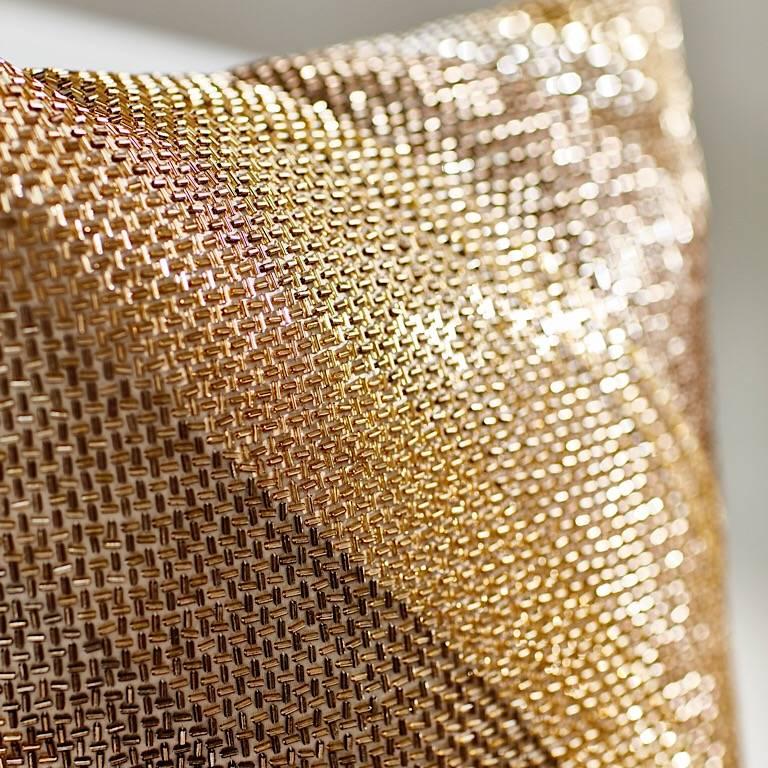 Pair of complimentary designed gold pillows with dusky pink tones.
Bugles beads in grid diagonal and abstract geometric small round beads.
Piped with feather pads.