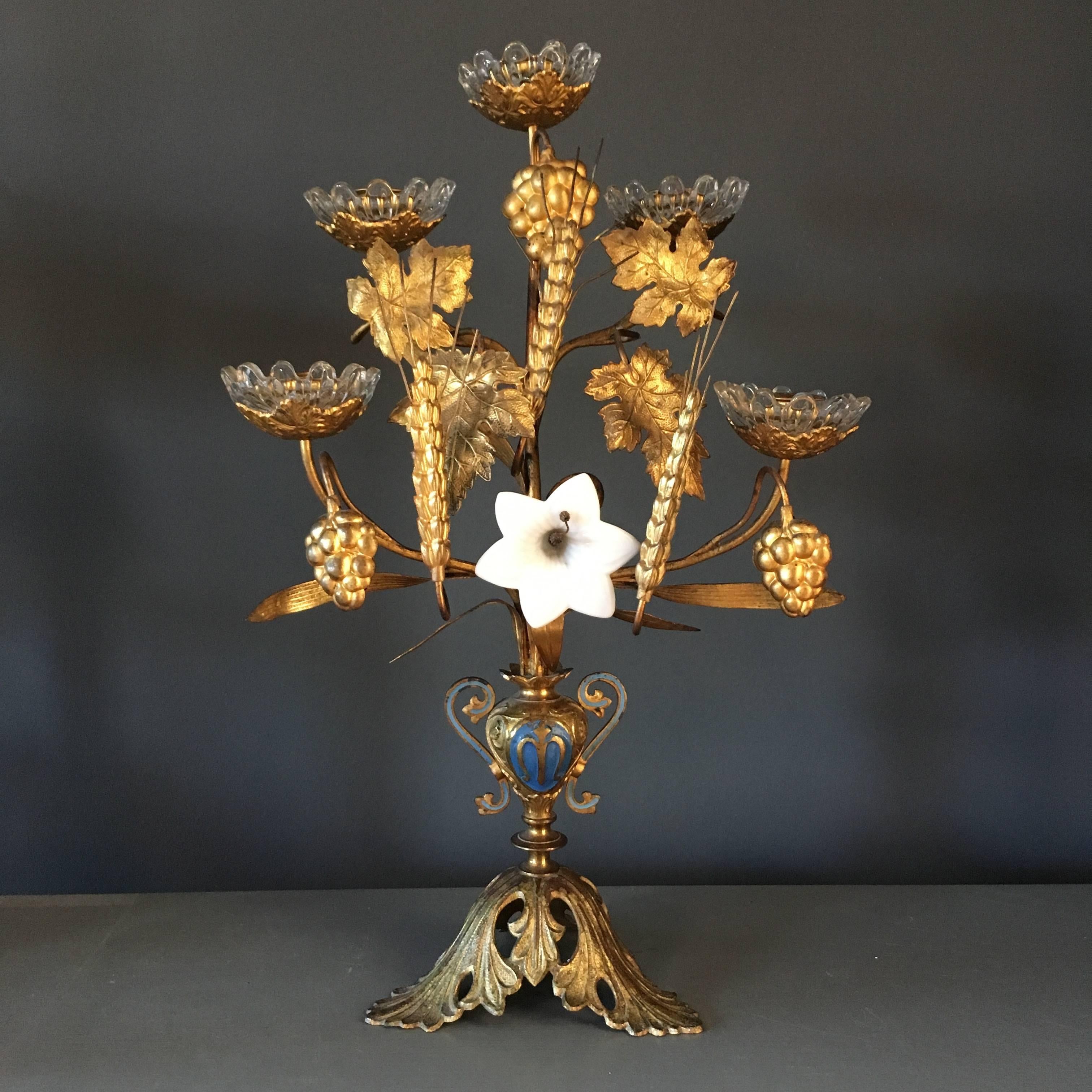 Late 19th century pair of French church candelabra 

Beautiful decorative details of wheat sheaf and leaves, grapes and ivy

Original white milk glass flowers

Original glass candleholder surrounds

Each candelabra holds five candles

Blue