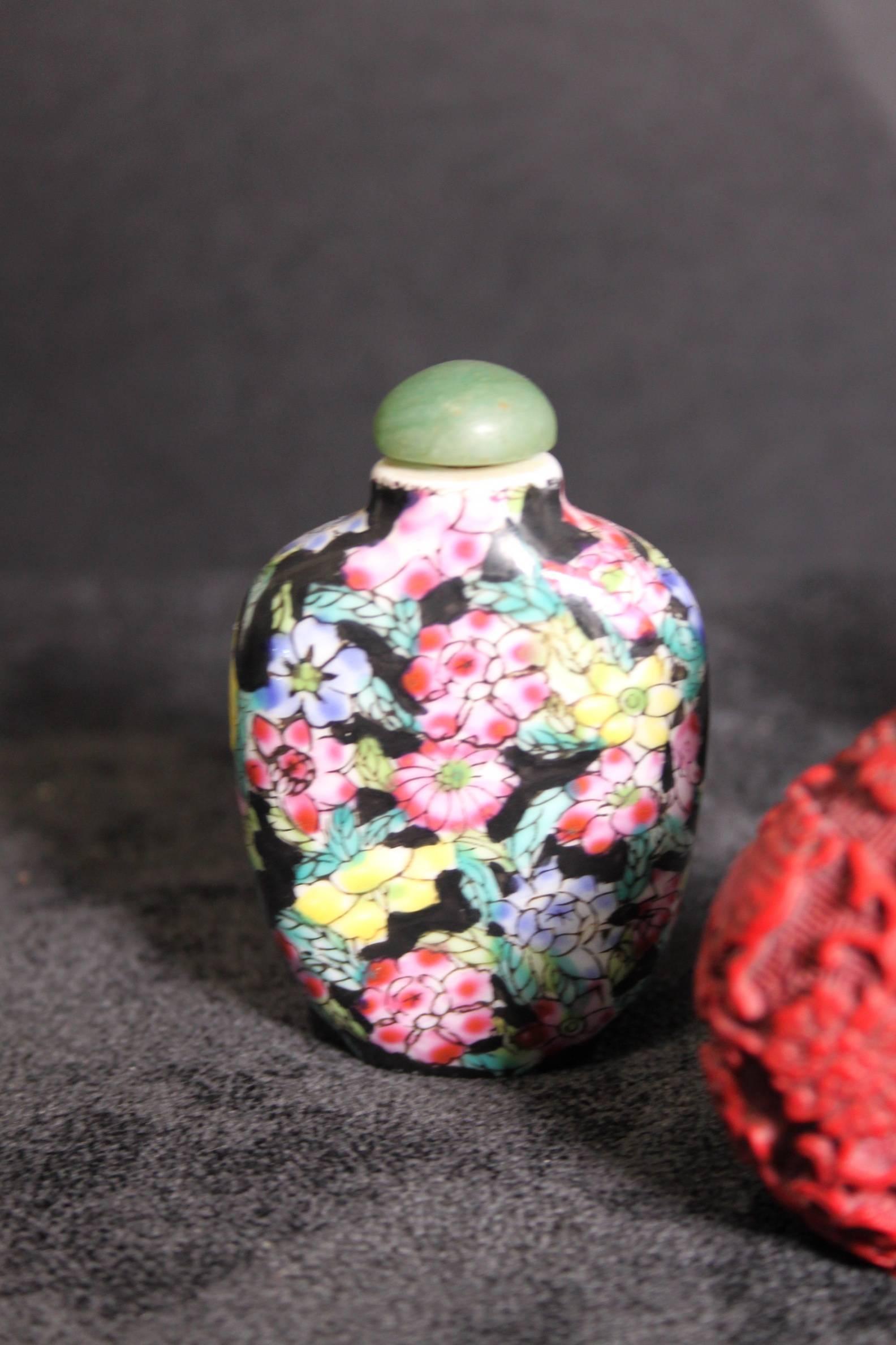 Three Chinese snuff bottles ranging in periods from late Qing to Republic. It should also be noted for any buyer, that the red bottle may be late 19th century, but the other two are early 20th century.