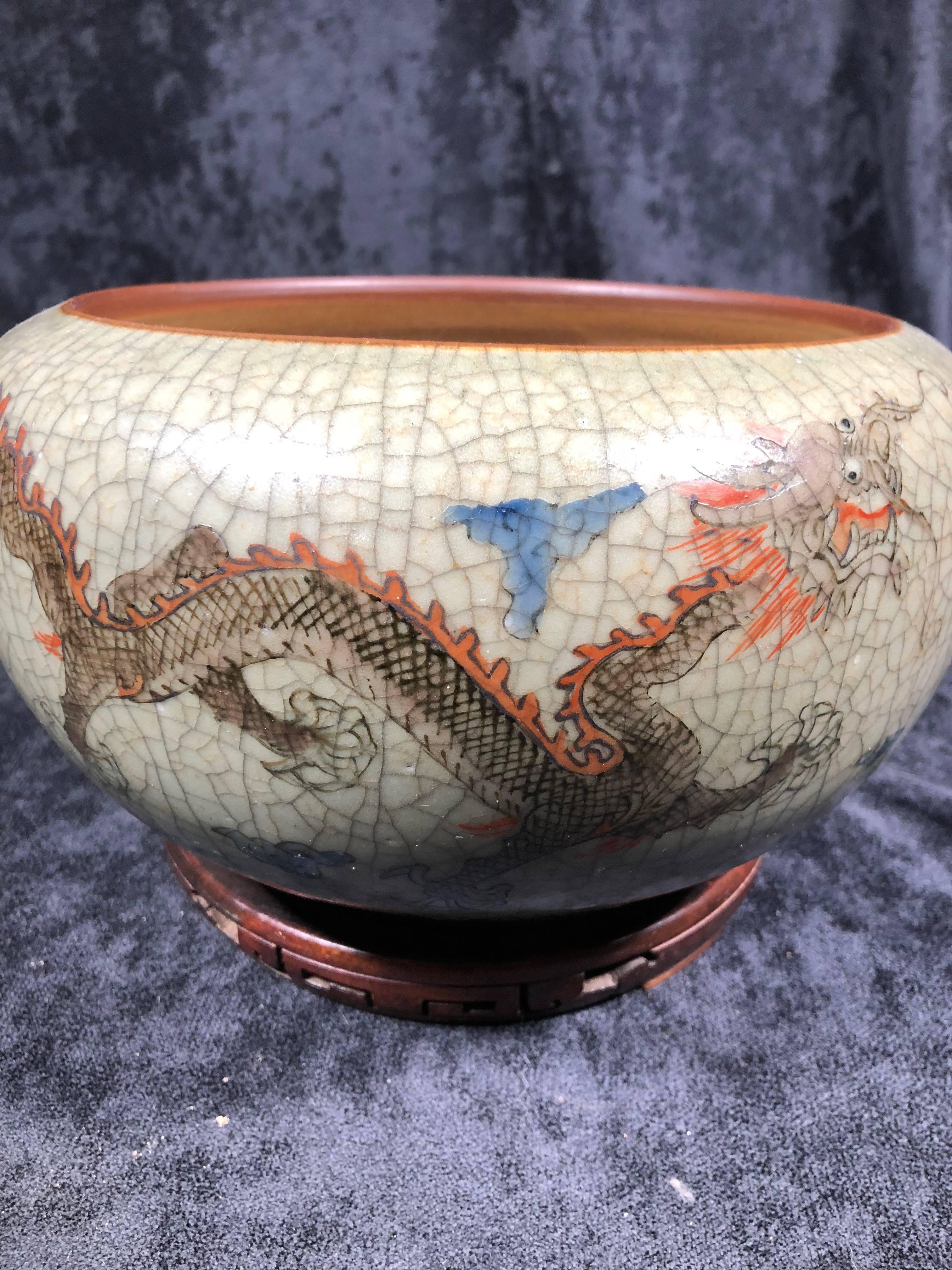 Very elegant Chinese early 20th century bowl from the Qing era. Possibly Northern Chinese in origin. Very unusual motifs of Buddhism paired with five toed dragon, Buddha's hand and various elements. Crackle celadon glaze and in excellent condition.