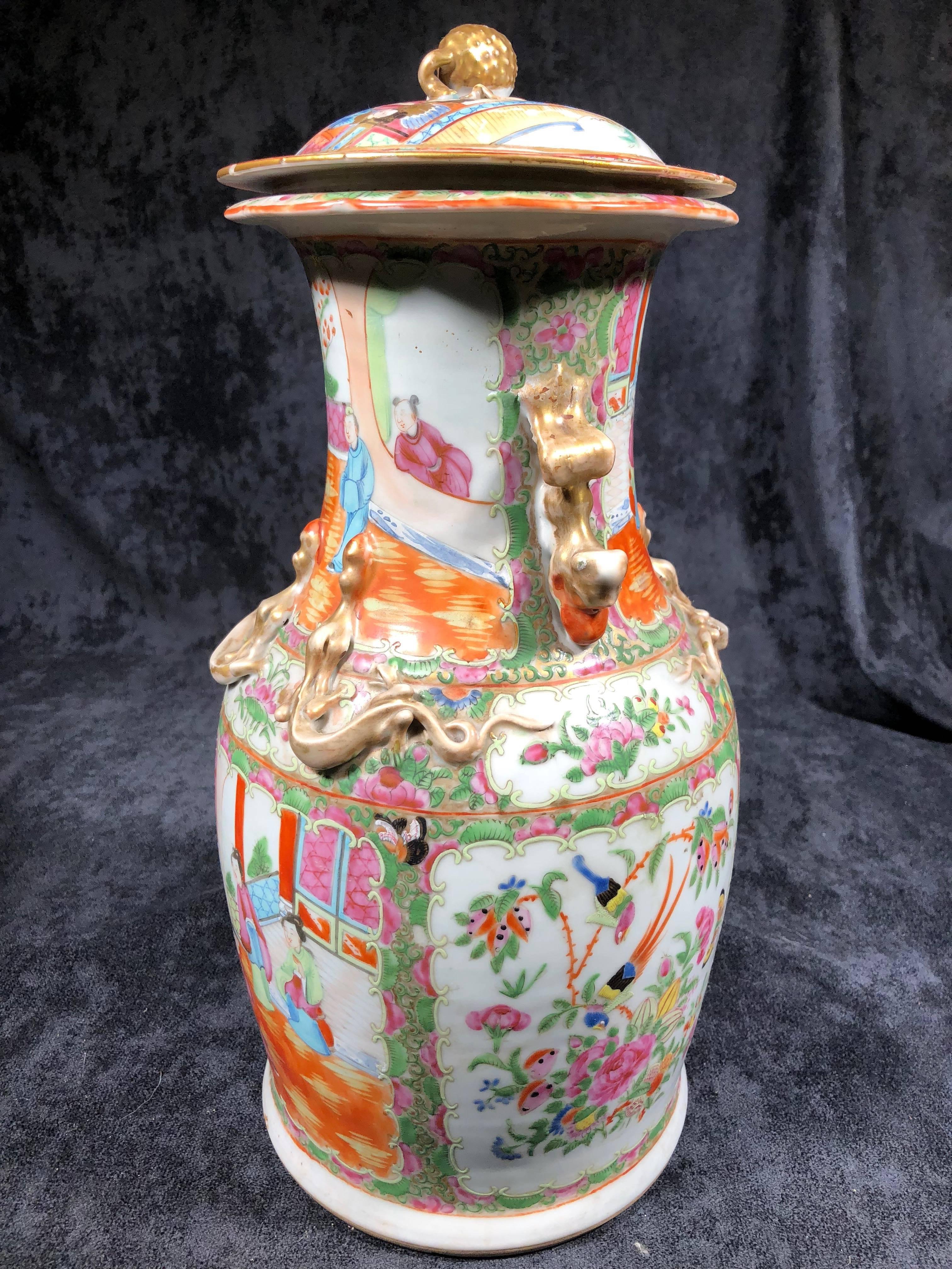 Famille rose pattern 19th century Chinese porcelain vase from Canton (Southern China) produced for export. Elegant example with lid. 19 inches tall by 9 inches wide.
