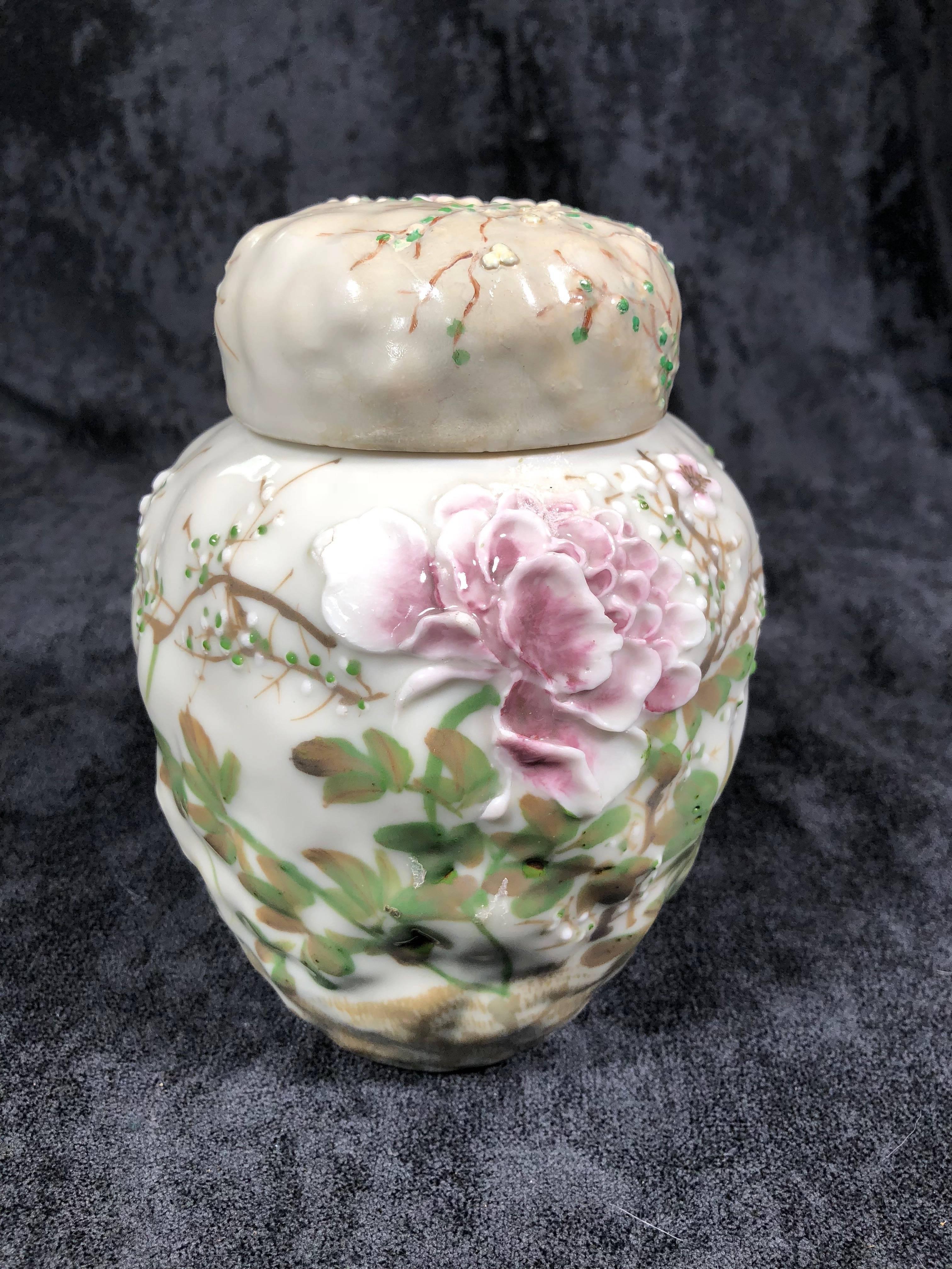 Very beautiful Japanese blossom pottery jar with lid. late Meiji period, Japan.  Measures 7 inches tall by 4 inches wide