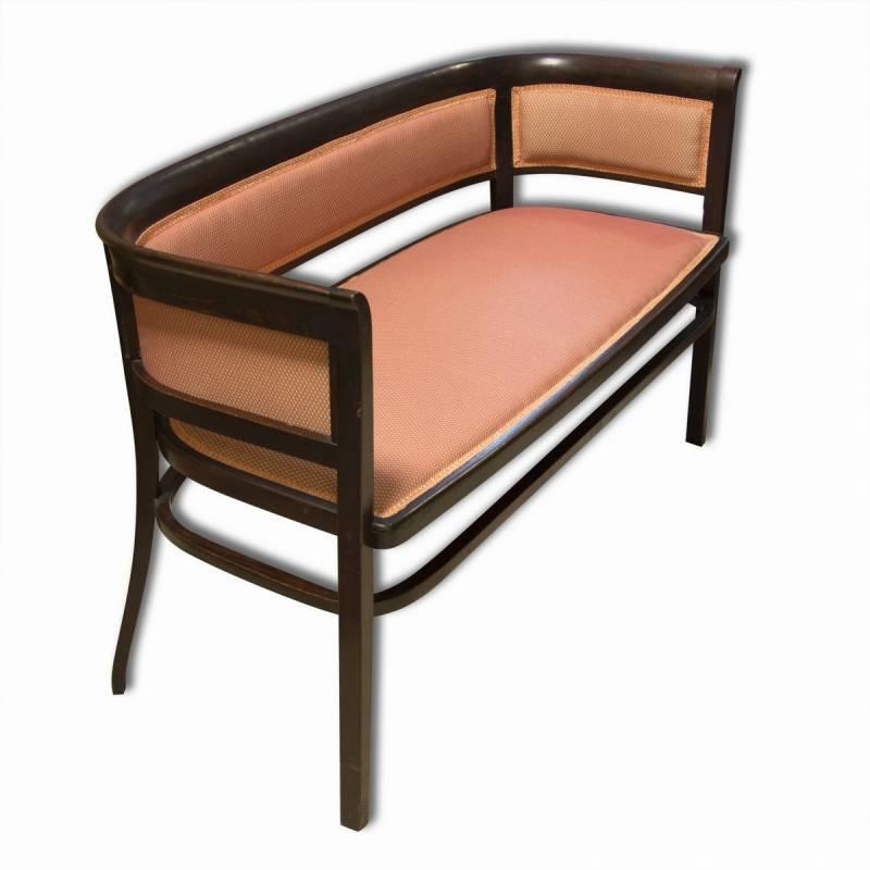 Upholstered bentwood Vienna Secession bench in the manner of Marcel Kammerer. It was made in Austria about 1910, probably for Thonet. The sofa has a darkened patina, hand-polished shellac finish. New upholstery in the original style.