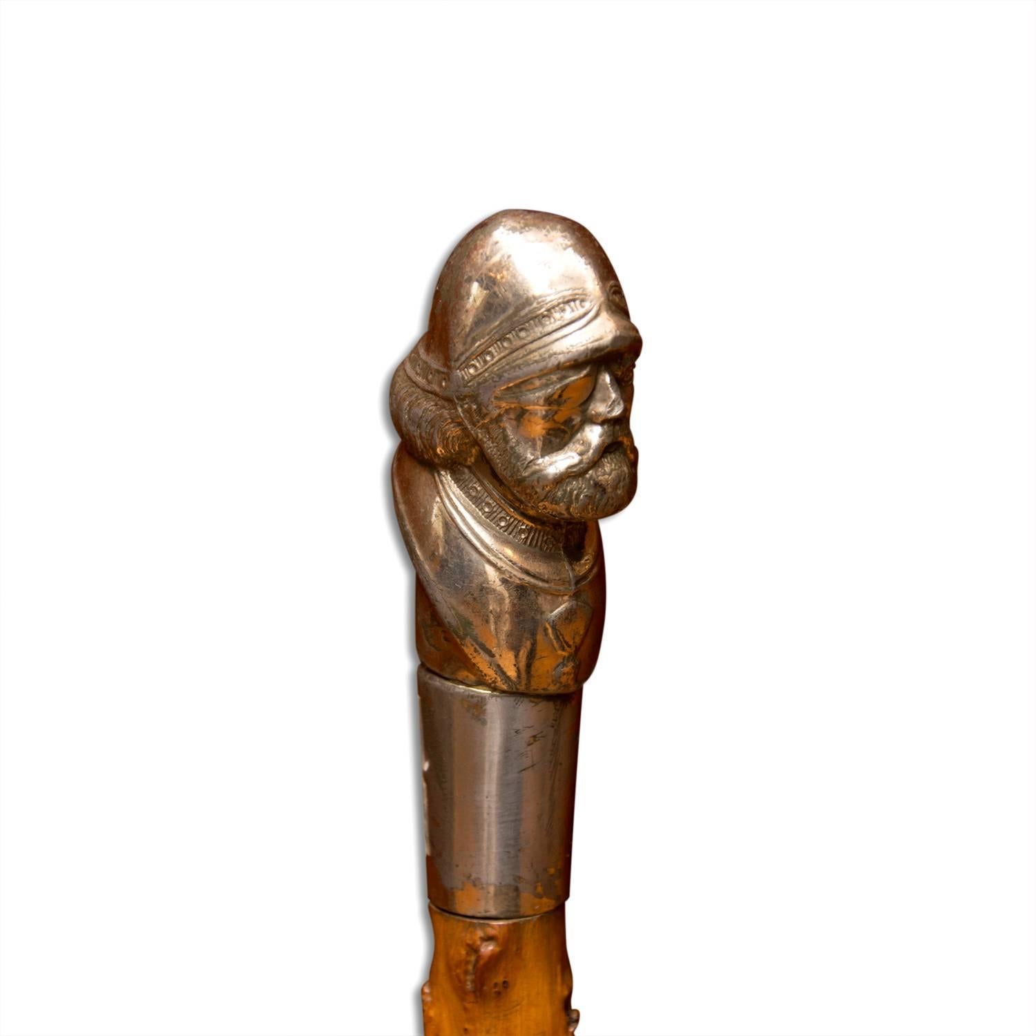Antique wooden walking stick made in Bohemia at the end of the 19th century. The stick is finished with a chromed portrait of the head of the historically most famous Czech Hussite leader Jan Žižka.