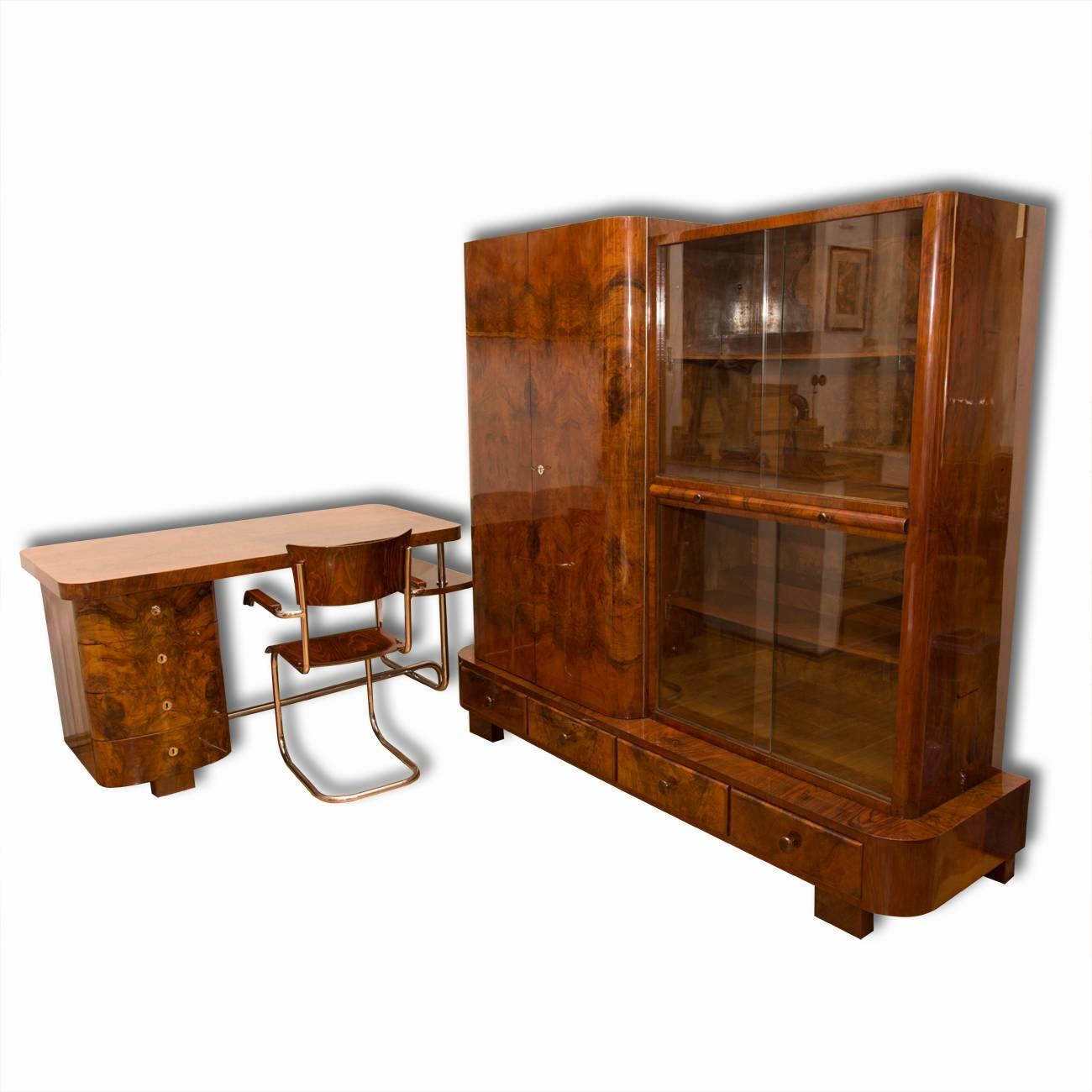 This library cabinet in walnut veneer was designed by Jindrich Halabala in the 1930s and produced by UP Závody Brno. The library comes from a functionalist villa in Karlovy Vary and is a part of the workroom, which also consists of a large desk also