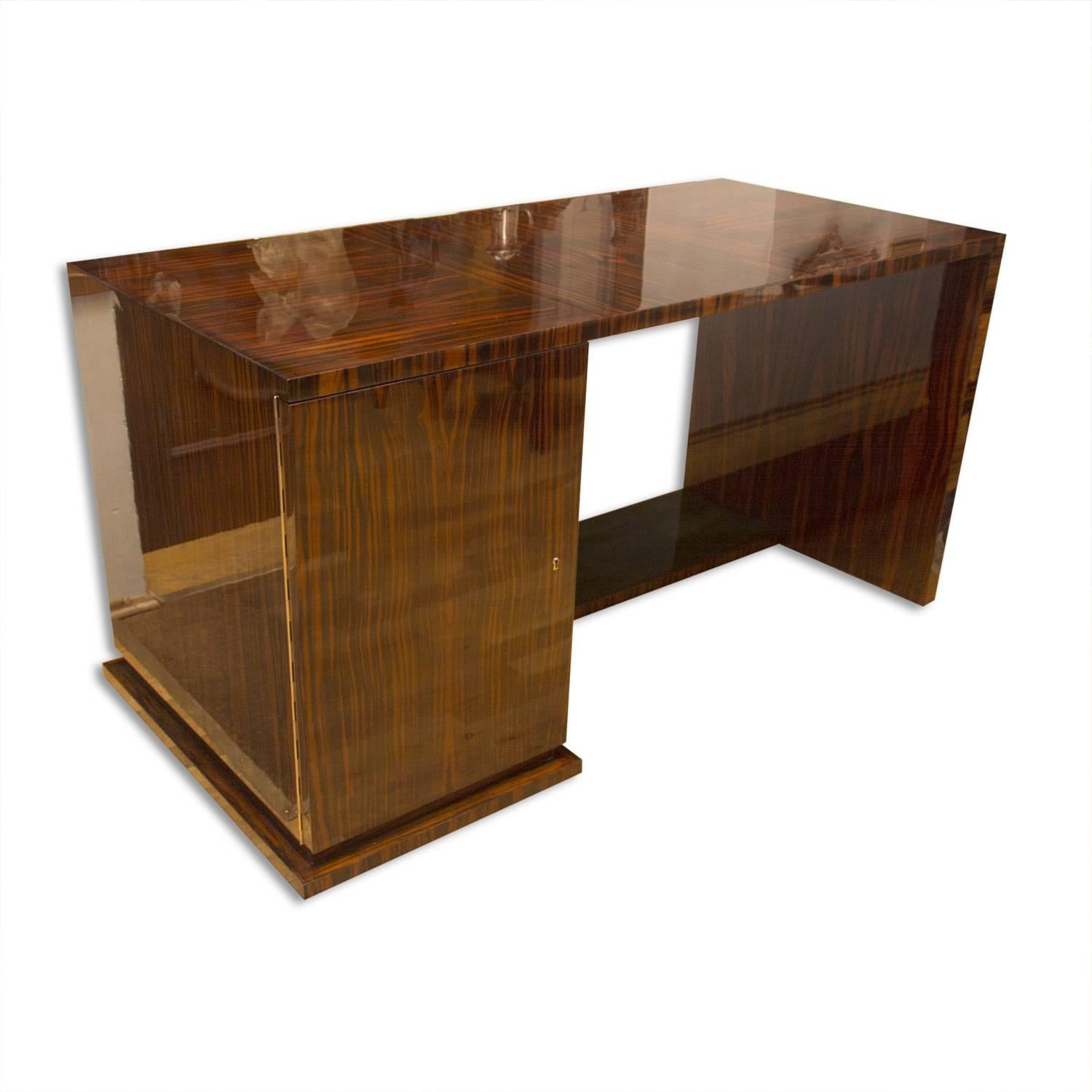 Functionalist macassar writing desk designed and produced in the 1930s by the famous Prague architect Vlastimil Brozek. It features a regular shaped typical for Functionalism in the 1930s. The desk was created by an architect for its own