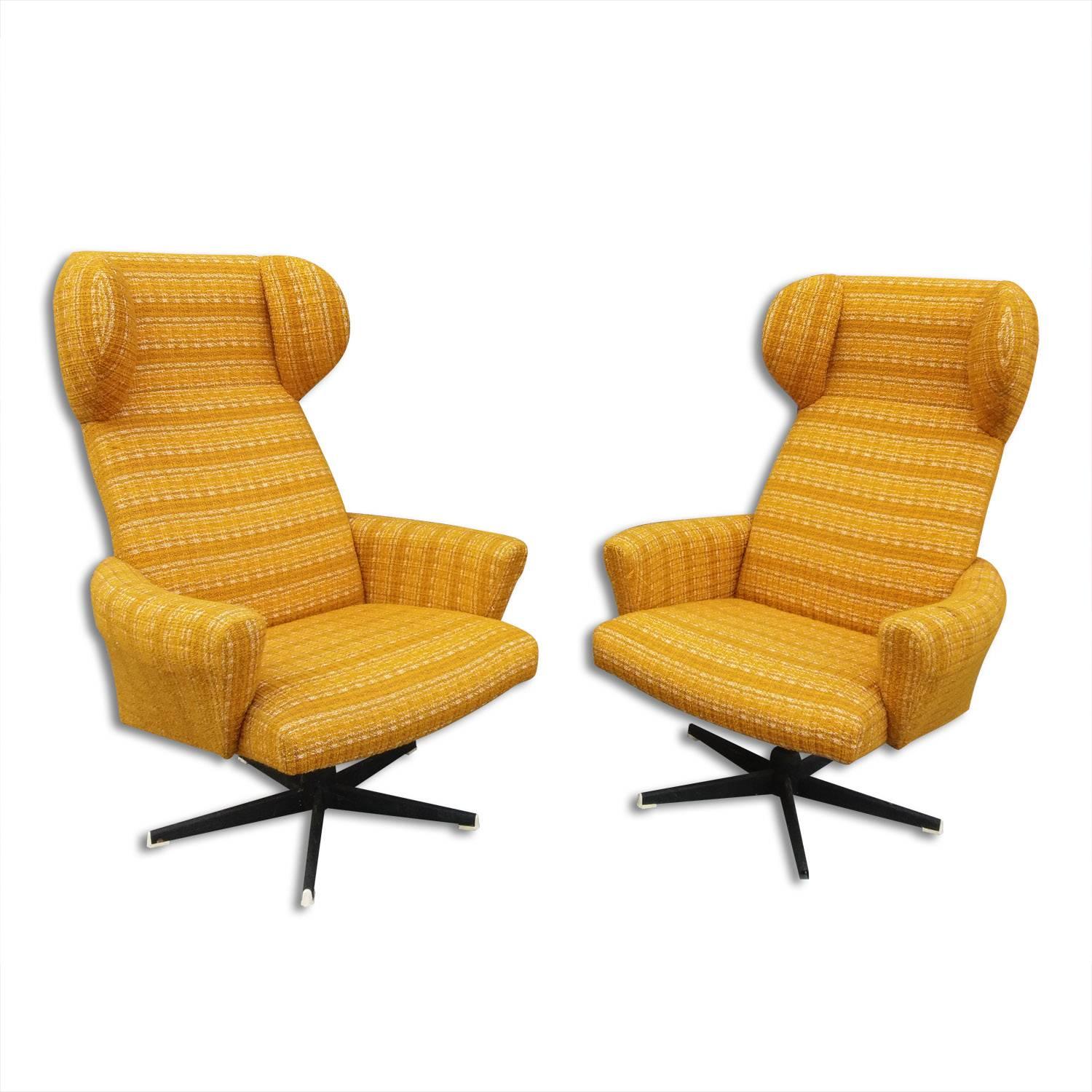 A pair of very comfortable wingback/High back swivel chairs produced by Drevotvar in the 1970´s. An interesting example of Czechoslovak furniture design. Upholstery in very good original condition without any damage. 

Height: 102 cm

seat: 70x80cm