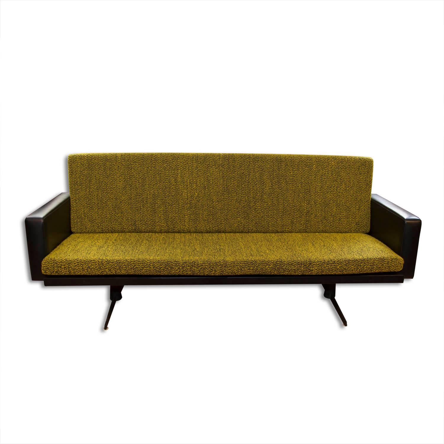 This lounge or office set was made in Czechoslovakia in the 1970s and consists of one sofa and a pair of swivel armchairs. The set is upholstered with brown leatherette and features original light green upholstery. The legs are made from iron. All