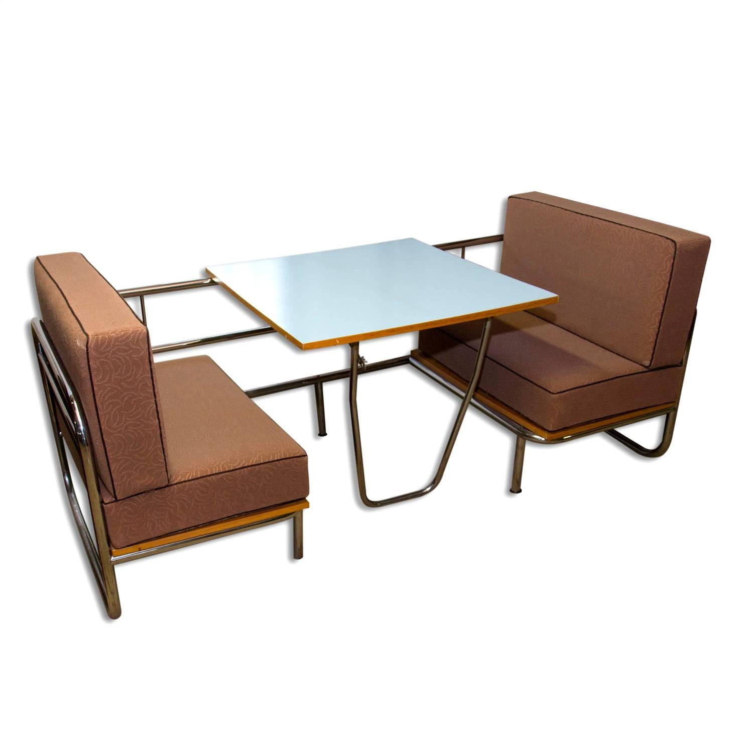 An outstanding and seldom-seen piece of mid century – functionalist furniture. A multipurpose seating including dining(coffee) table in combination with sofa bed. Chromium plated construction of the sofa. Material: chrome, laminate, particle board,