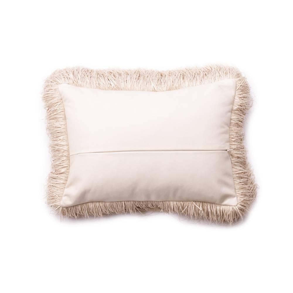 Antique kuba cloth with an inset cream leather hand stitched under the antique fabric. This pillow is finished with a 3 inch raffia fringe and a cream leather back.
Made in Los Angeles and includes down insert.
 

Dimensions: 16 in x 11 in x 6