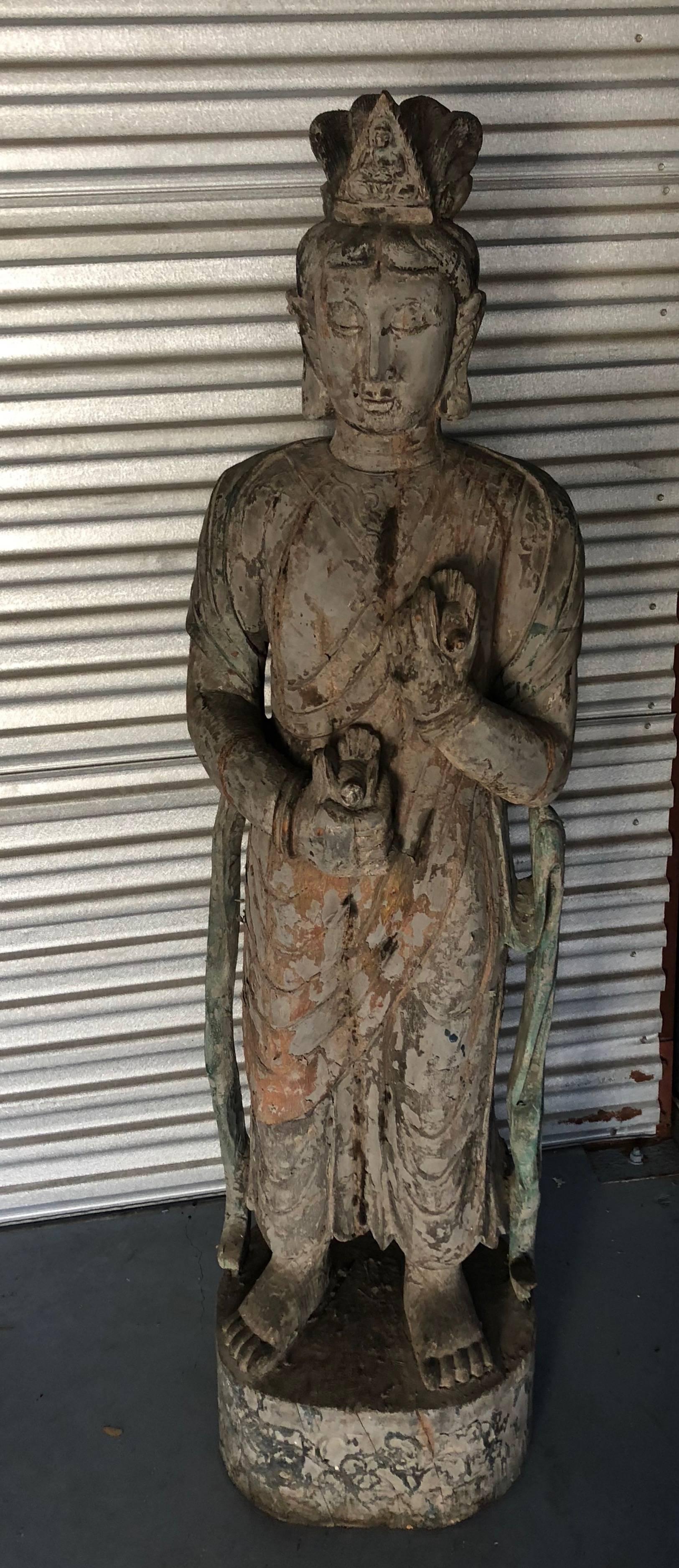 This Ming dynasty style Guan Yin statue is hand-carved, wooden and has been finished with a green lacquer Please see the enclosed certificate I received from the Veng Son Art Craft Company 10/12/02. She has birds in hand and ribbons flowing from her