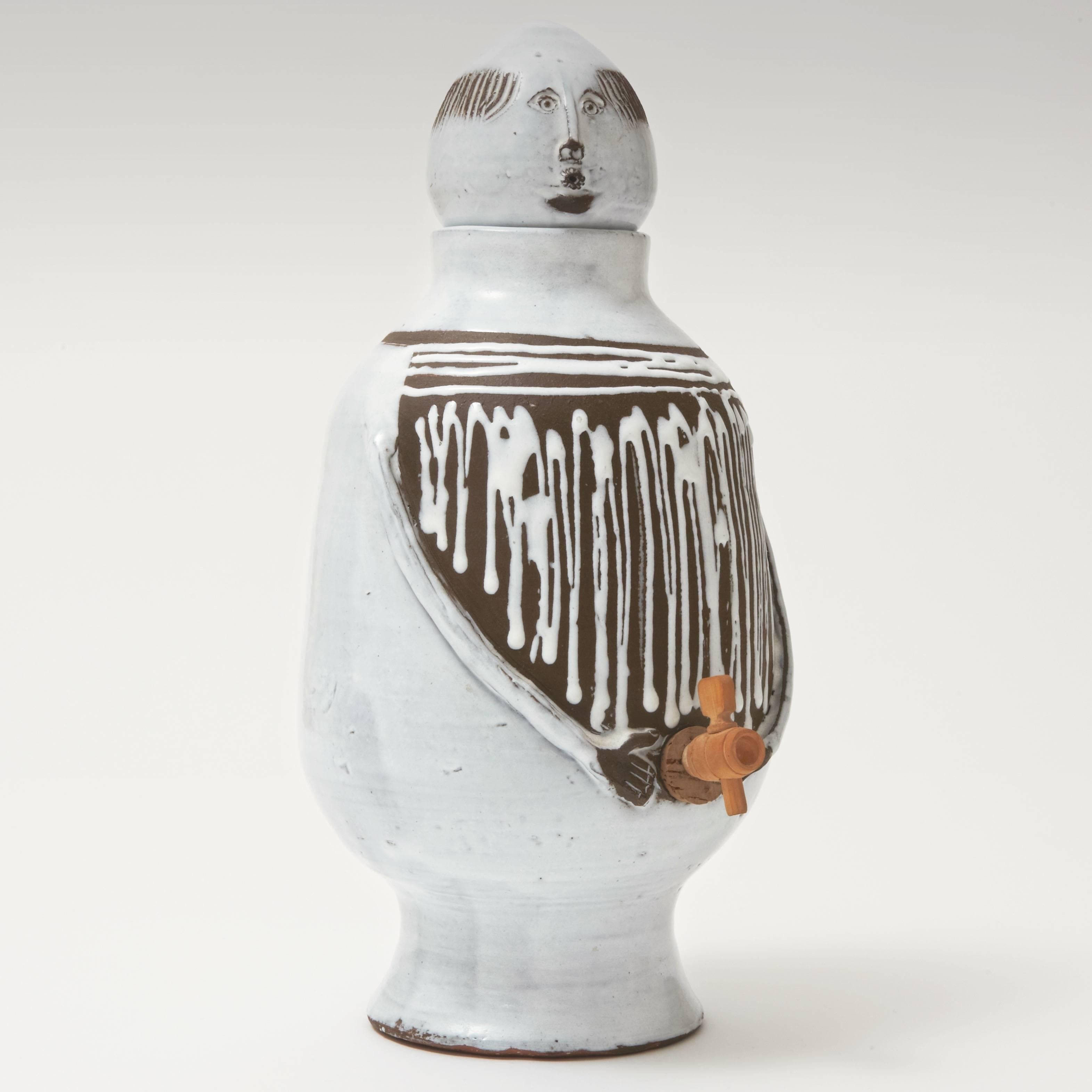 Biomorphic lidded pot, or beverage dispenser, with his removable head, and with its (funny) wooden and cork tap to dispenser.
Handmade decorative ceramic piece, created in Vallauris, by Pyot and Albert Thiry (signed). 

Textured clay with