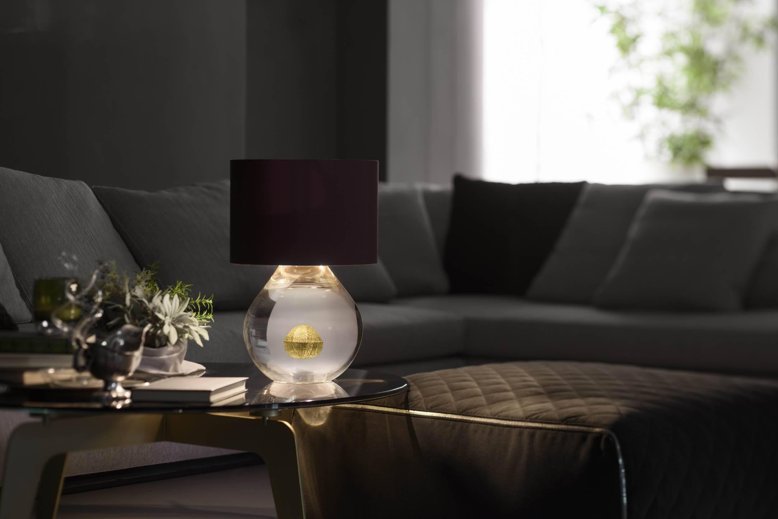 Anima is from our contemporary Sommerso collection of table lamps. The minimal design requires exceptional mastery of glass, which is free-blown (no mould is used) by ARS Murano. It was designed by the prize-winning Brogliato Traverso studio in