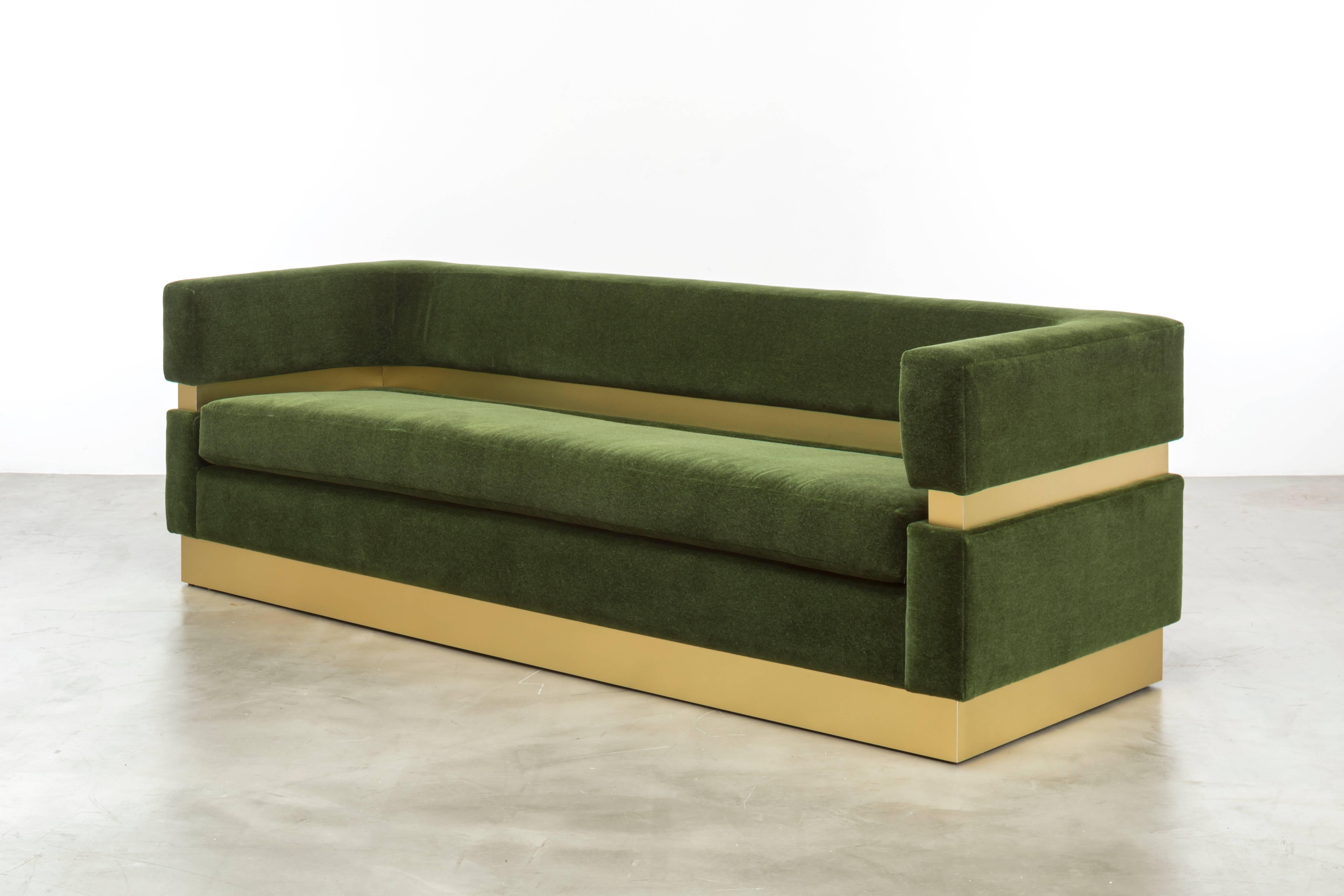 The Cardin Sofa features layers of upholstery and metal inlay to create a minimal and modern sitting statement.  Fully custom and made to order in California. As shown in Emerald Green Mohair $18,680.00.  Starting at $13,380.00