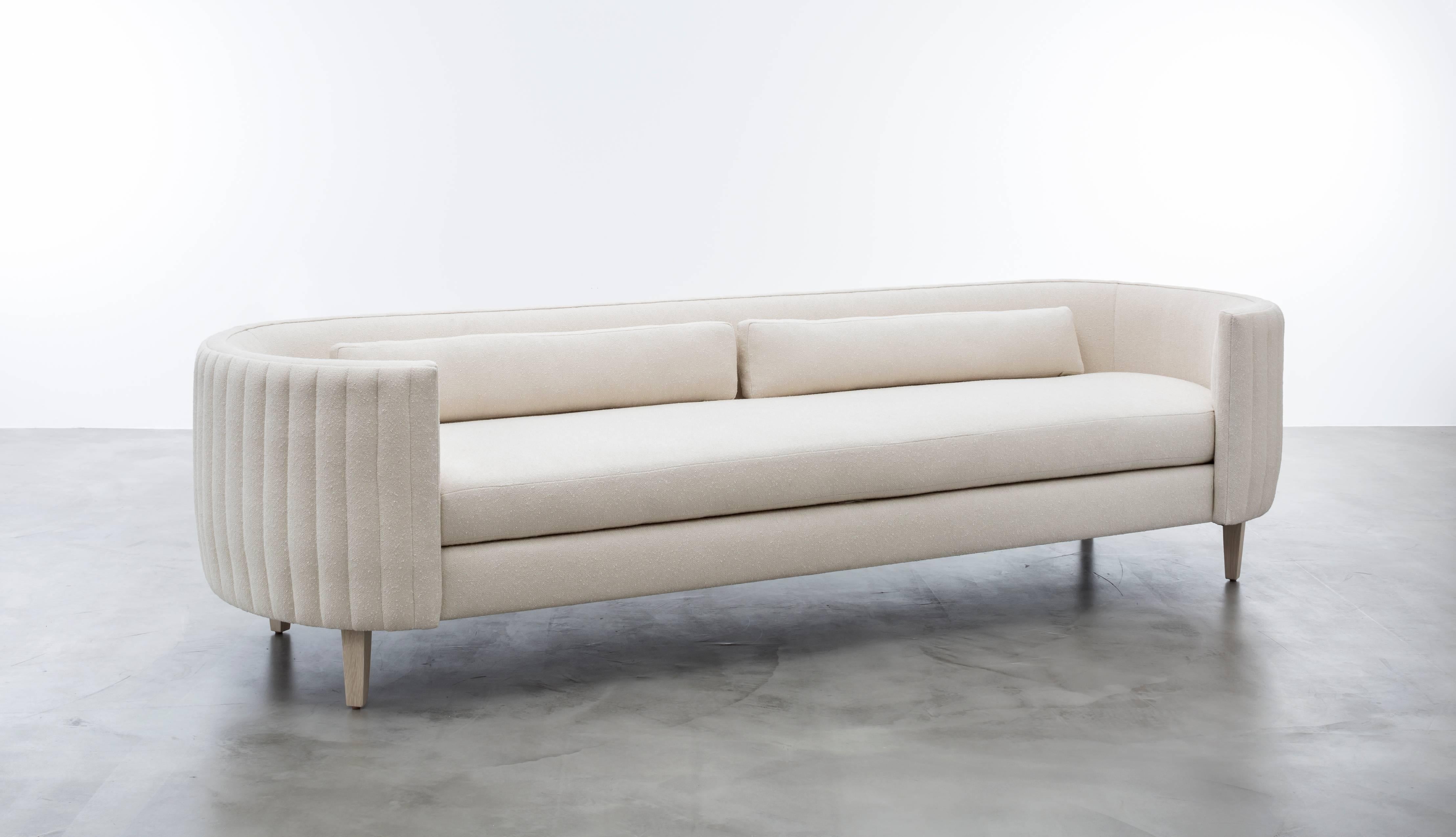 CLARISSE SOFA - Modern Sofa in Cream Boucle

The Clarisse sofa is a modern and stylish addition to any living space. Its high-end construction and premium materials make it a durable and long-lasting investment piece. The wooly lamb boucle
