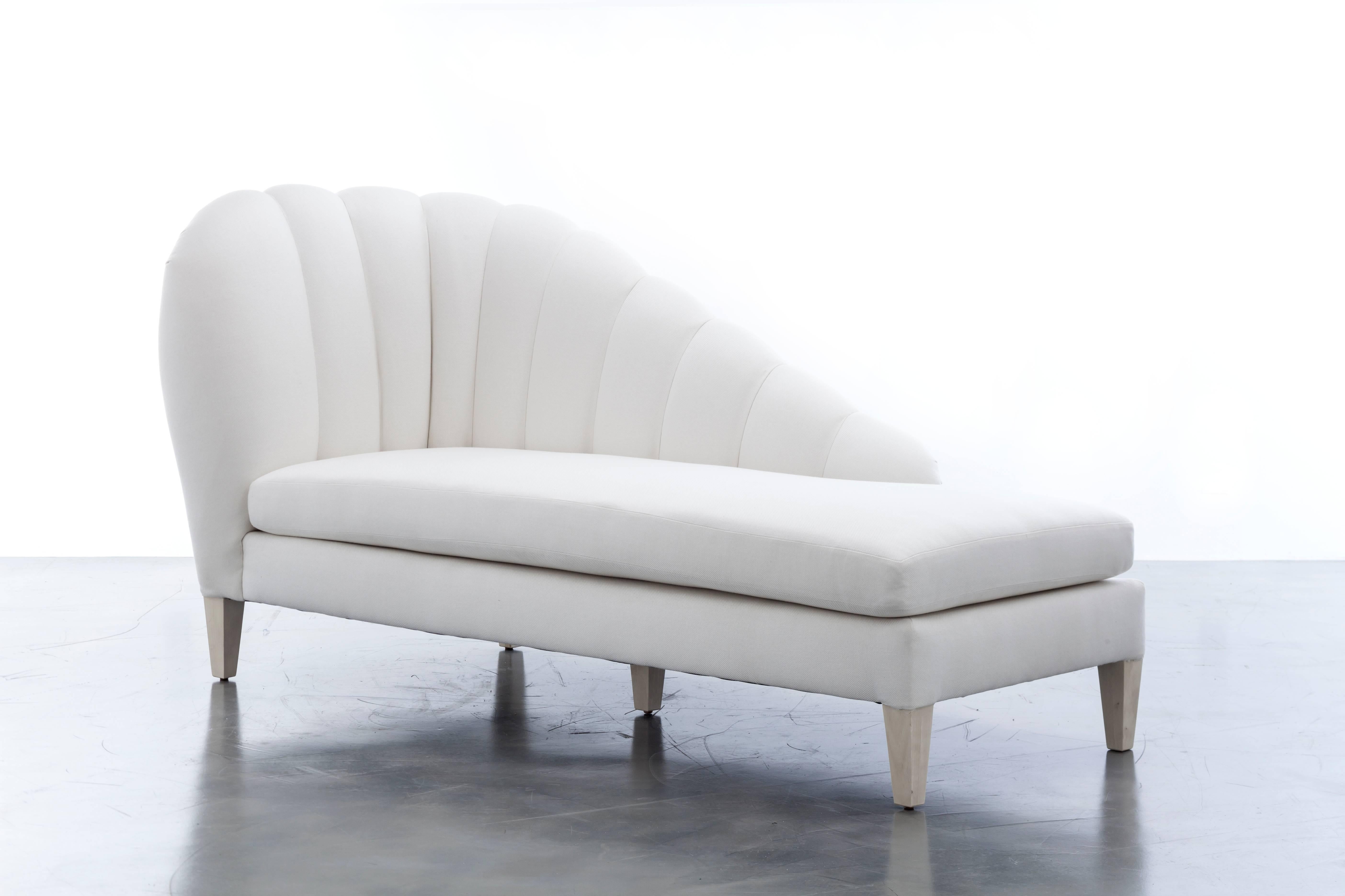 The Guinevere Chaise inspired by the curvature of Gaudi architecture features an asymmetrical channeled scalloped slope that meets and rests over four wooden legs.  Fully custom and made to order in California.  As shown in Bamboo White $9,200.00.