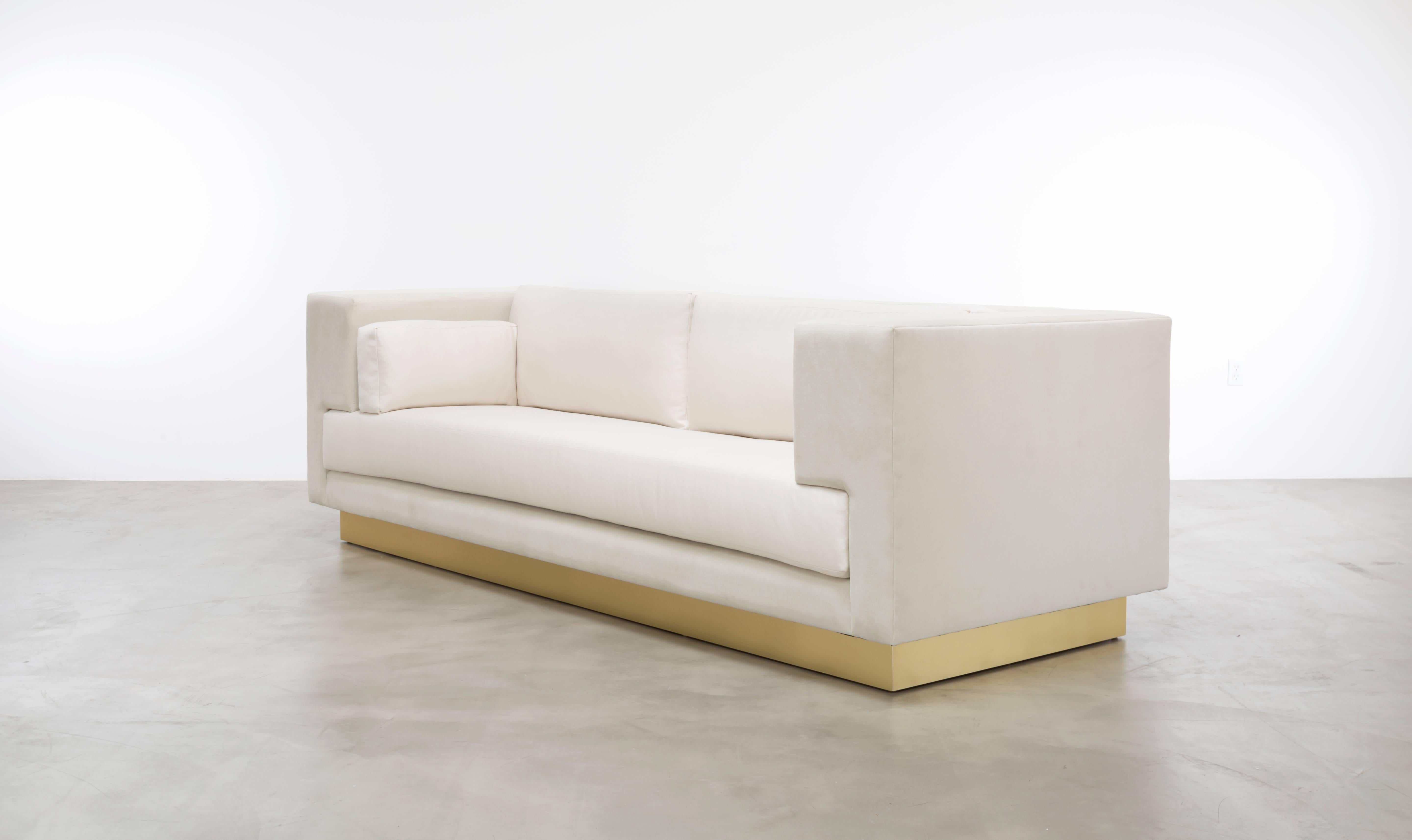 The Lacroix Sofa is a meticulously crafted piece of furniture designed to provide both comfort and a sleek, modern aesthetic. It boasts a unique plinth cushion along with back and arm pillows, which collectively form a minimalistic yet luxurious