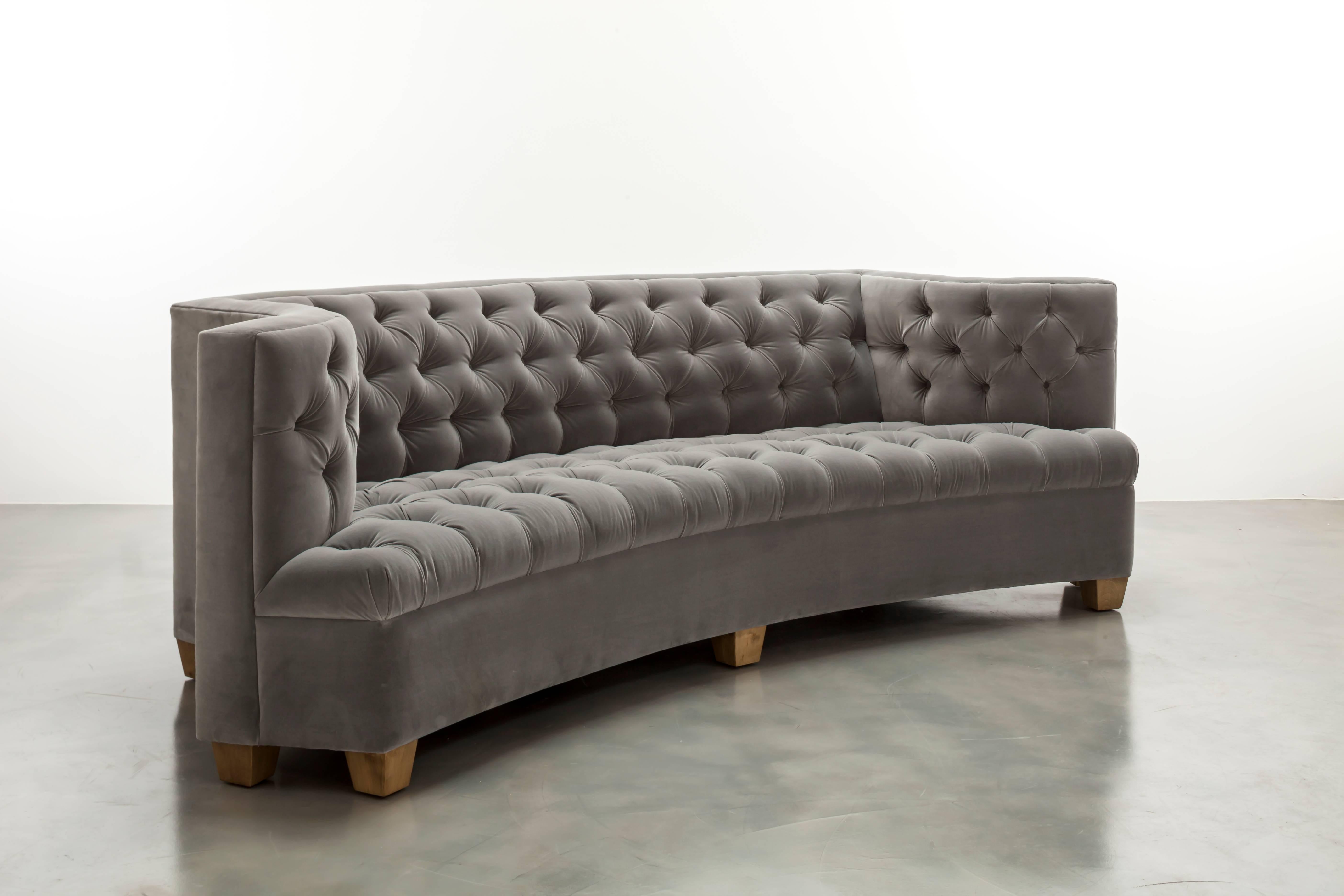 The Colette Sofa features a modern tufted tightly upholstered frame with winged arm details.  Fully custom and made to order in California. As shown in Luxury Velvet $9,715.00.  Starting at $8,000.00.