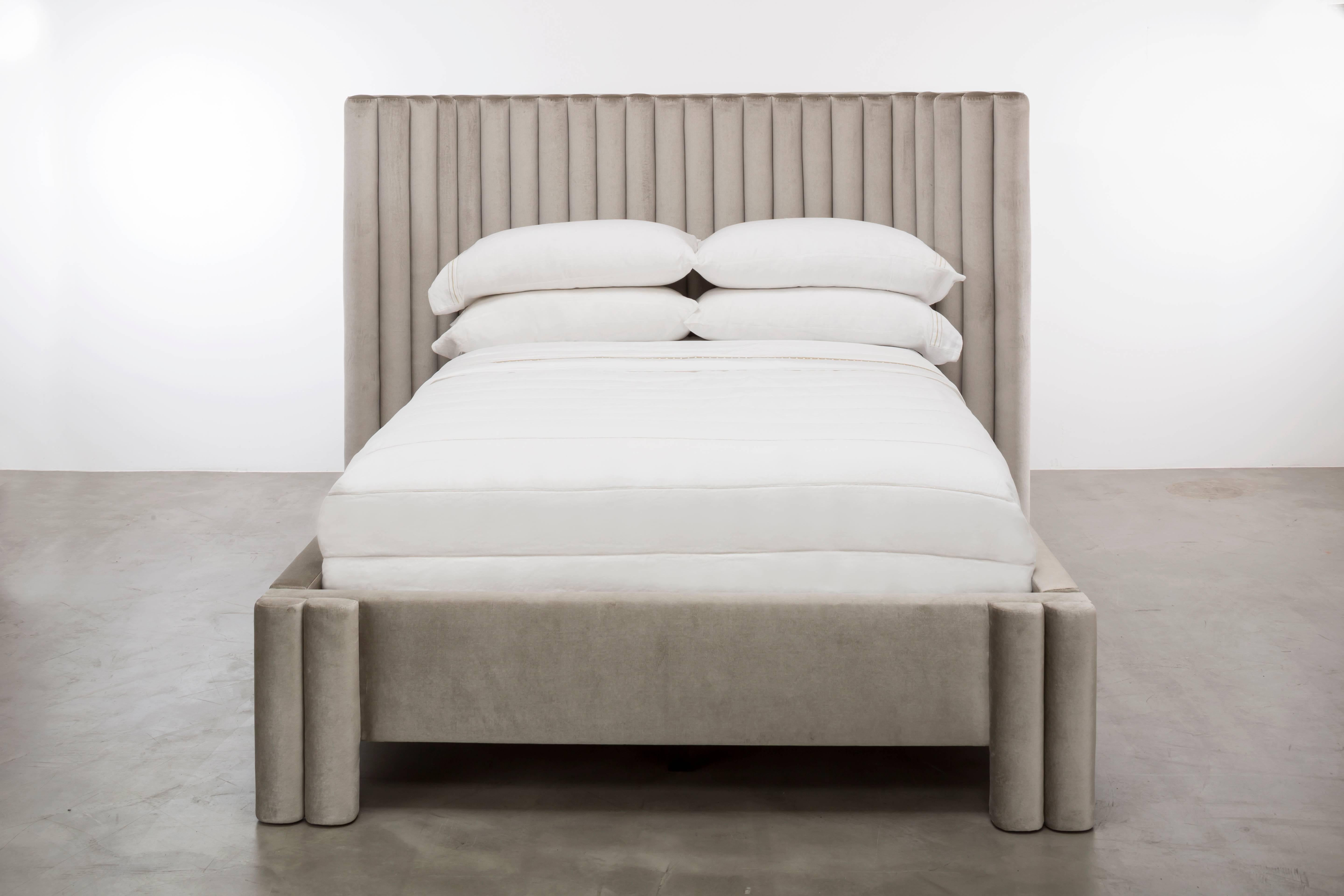 The Sacha Bed features a sexy, modern and vertically channeled headboard and upholstered frame with a fully upholstered platform system.  Available in King, Cali King, Queen or Twin sizes.  Headboard height can also be customized.  As shown in Queen