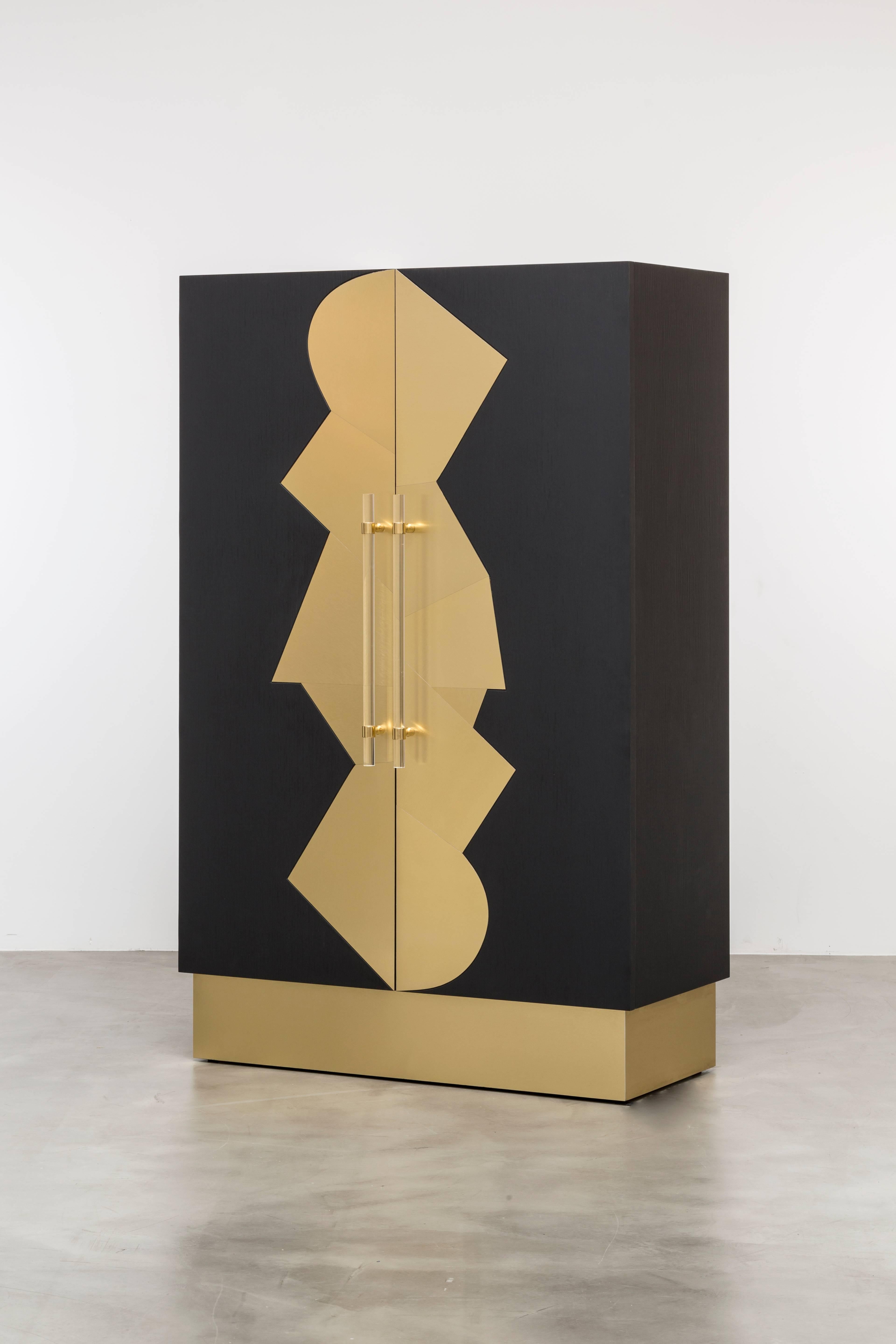 COCO CABINET - Modern Ebony Oak Cabinet with Brass Inlays and Acrylic Handles

The Coco Cabinet is a luxurious piece of furniture that features an Art Deco-inspired design, with a fractured brushed brass inlay detail on an ebony oak body. The