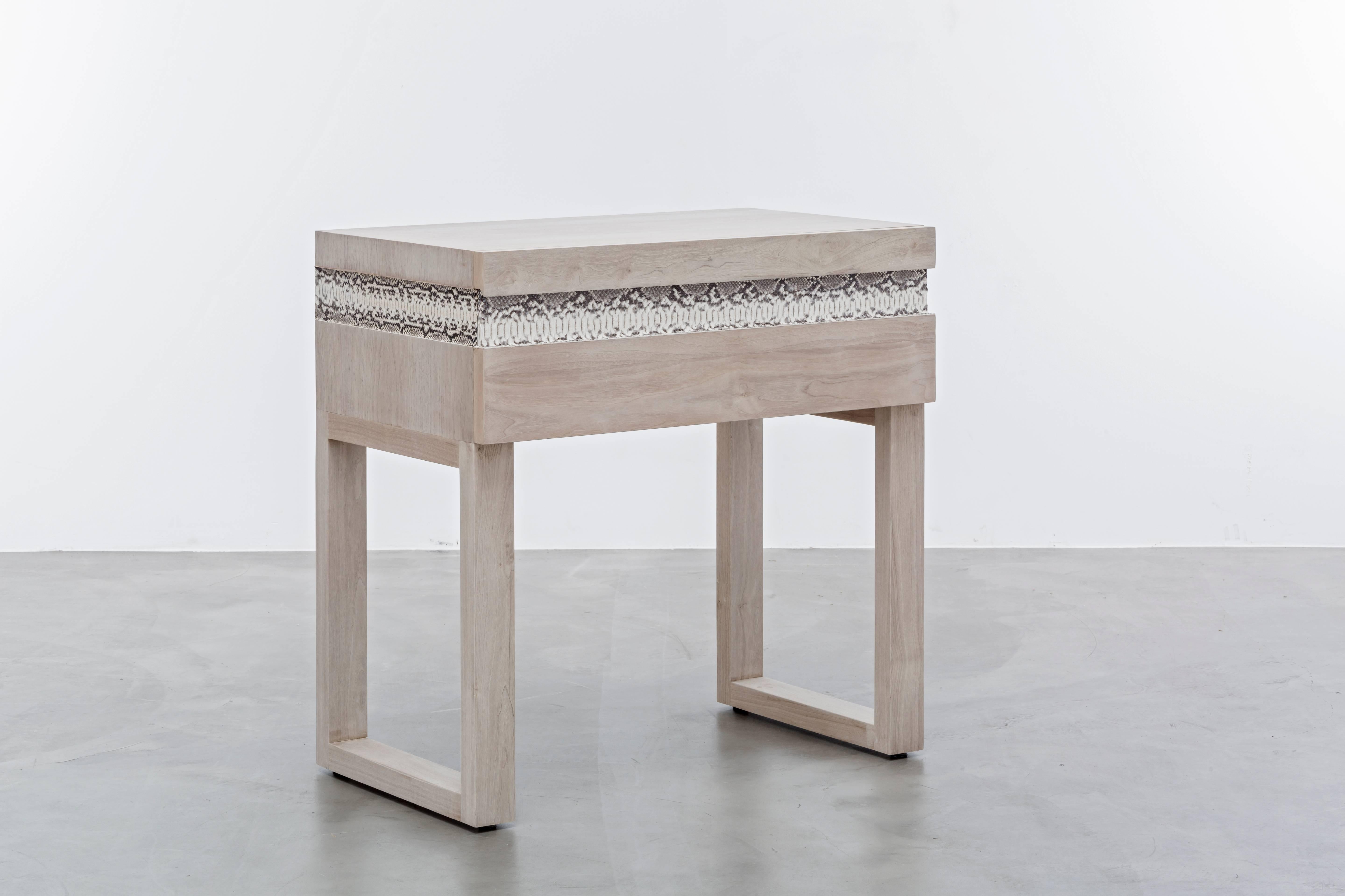 SIMONE NIGHTSTAND - Bleached White Oak Side TAble with Authentic Snakeskin

The Simone nightstand is a beautifully crafted piece of furniture that showcases a unique and luxurious design. It features a bleached walnut body that provides a natural