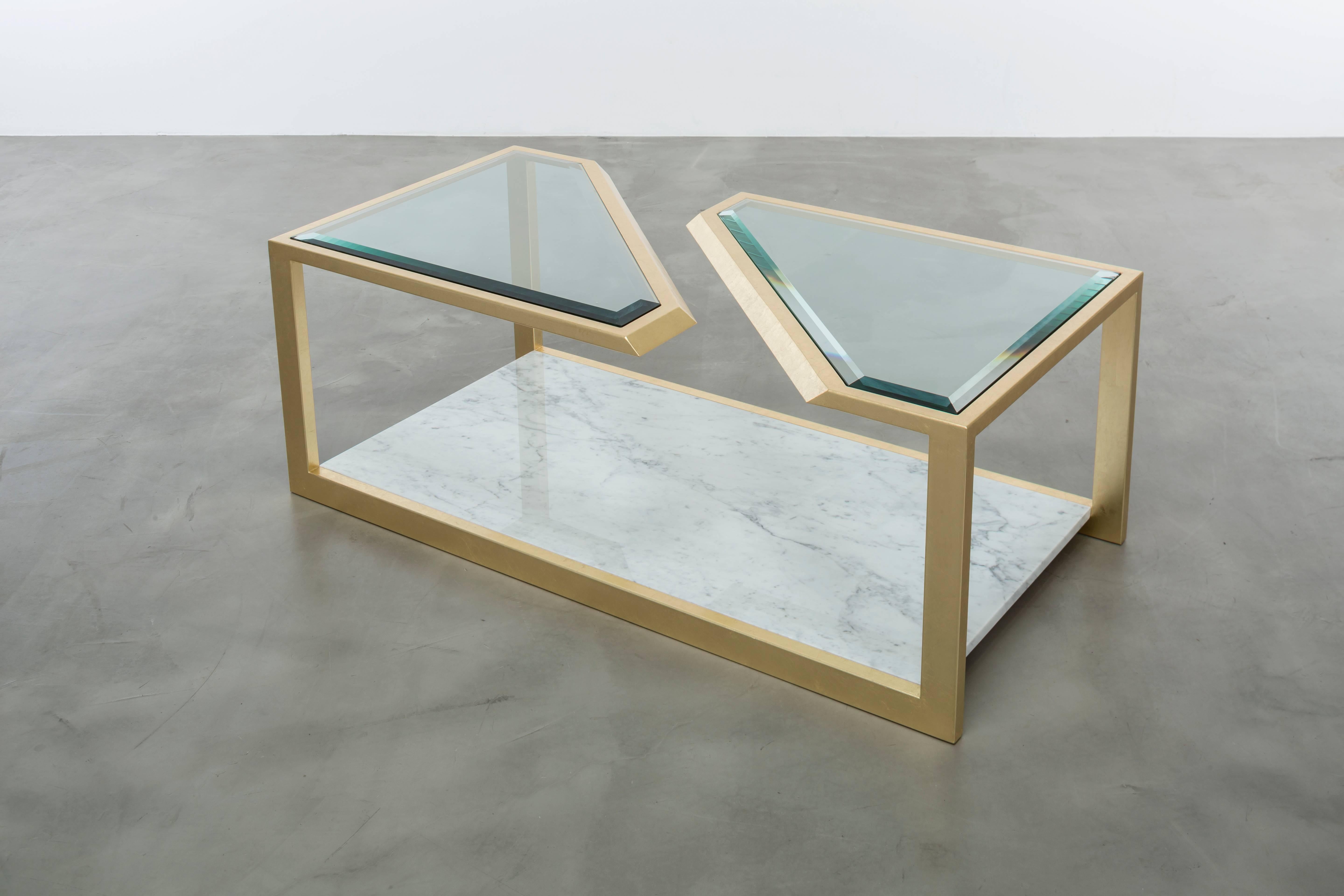 PIERRE COFFEE TABLE - Modern Carrara Marble with Gold Leaf and Beveled Glass

The Pierre coffee table is a stunning and modern fractured gold leaf cocktail table made of gold leaf over iron with a combination of Carrara marble and beveled edge