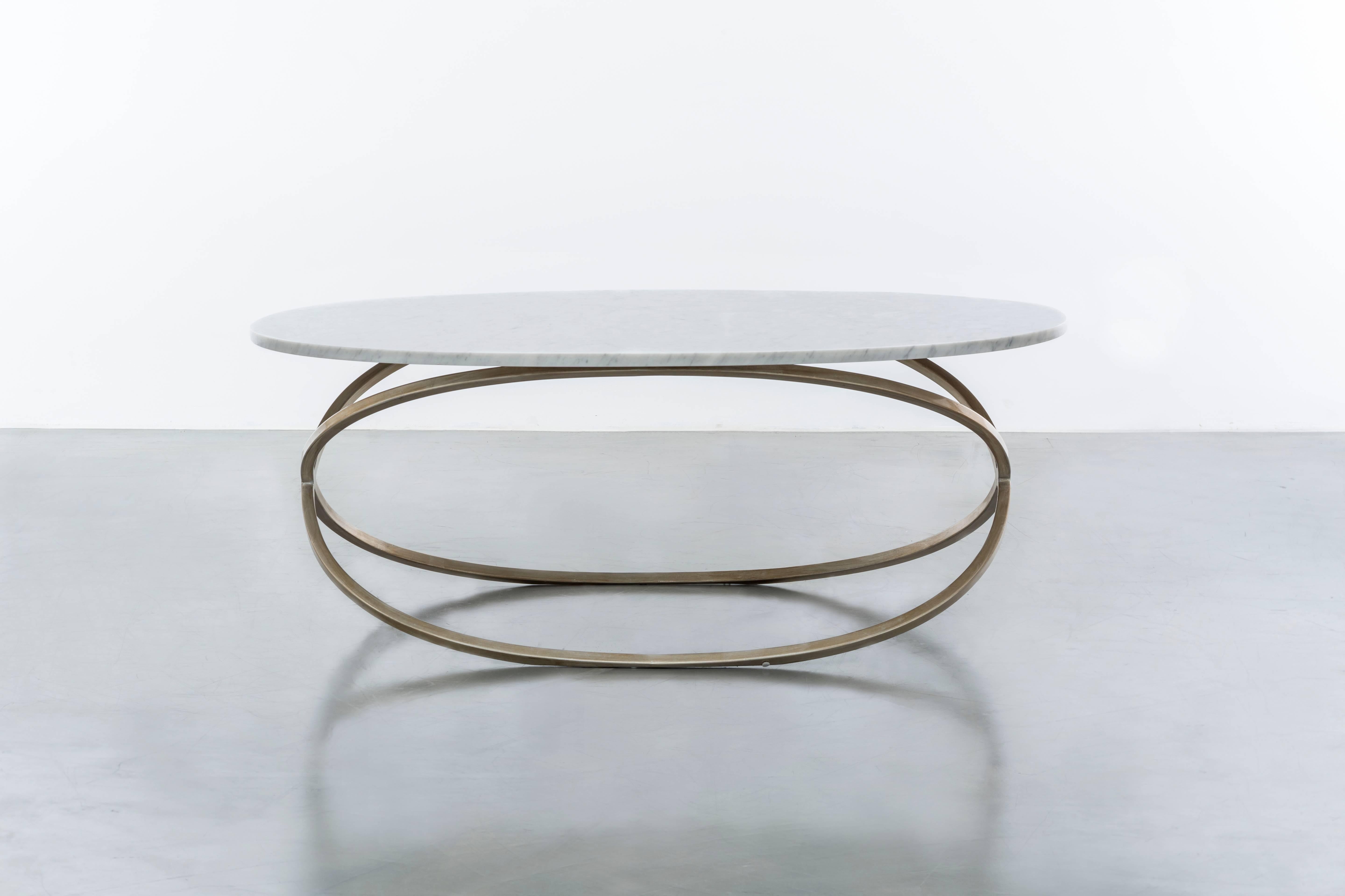 CHANTAL COFFEE TABLE - Modern Oval Cocktail Table with Carrara Marble

The Chantal coffee table is a sleek and modern oval-shaped cocktail table that features a luxurious Carrara marble top. It is made to order in California and fully customizable