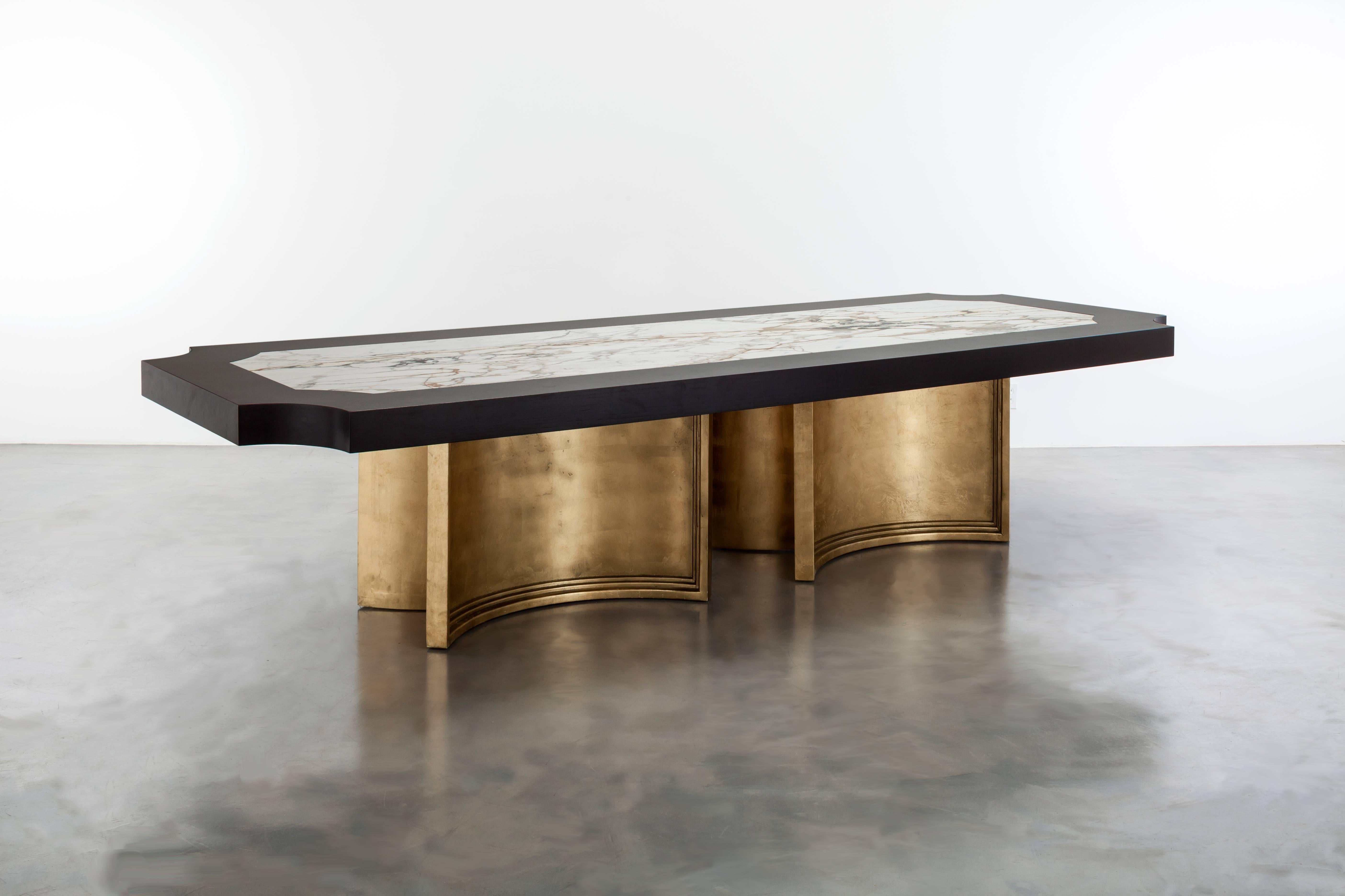 BRUSSELS DINING TABLE - Ebony Oak, Carrara Marble and Gold Leafed Modern Table

The Brussels dining table is a luxurious and modern piece of furniture that is perfect for any contemporary dining space. It is made to order in California and fully