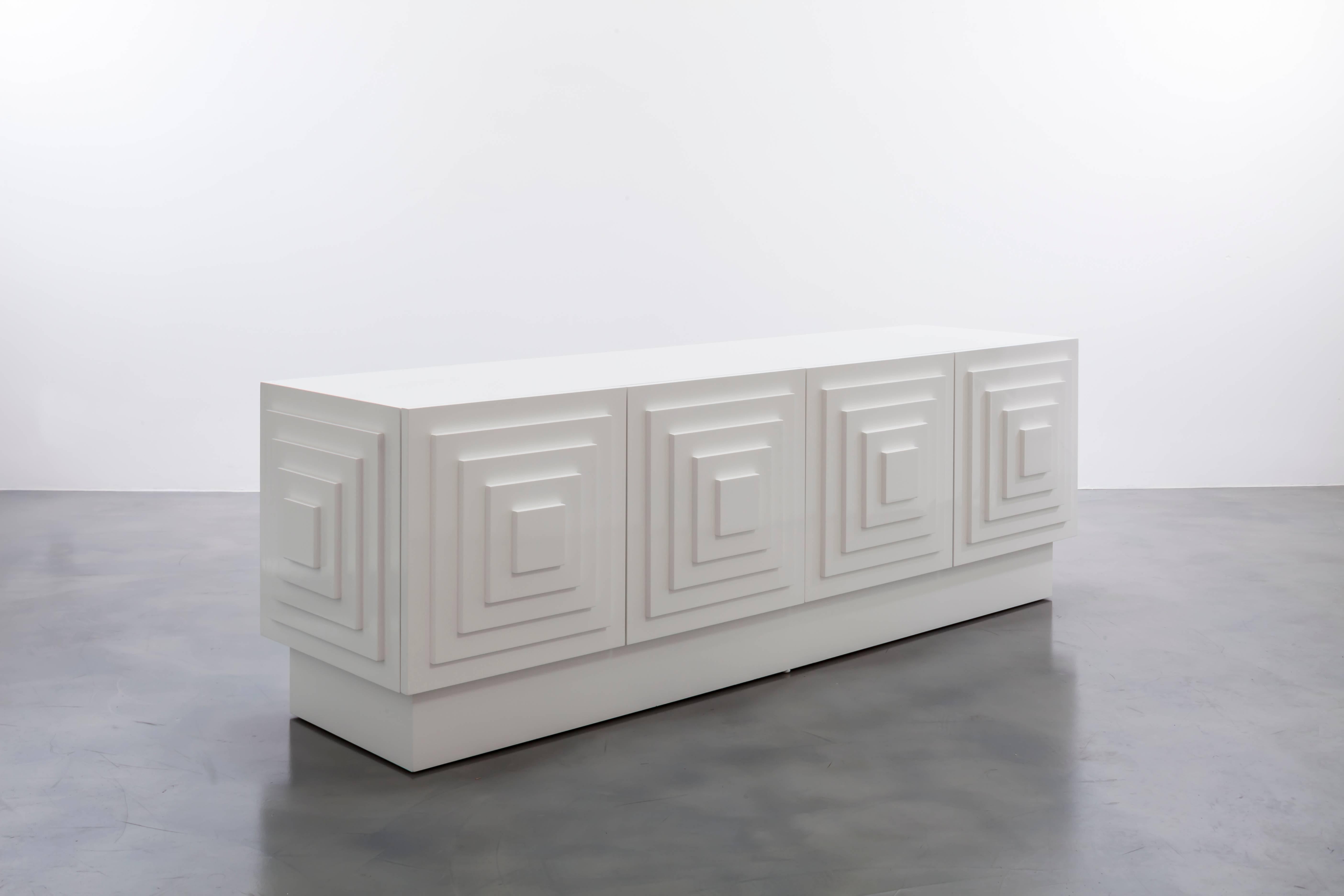 GAULTIER MEDIA CREDENZA - Modern Geometric Cabinet in White Lacquer

The Gaultier Media Credenza is a stylish and functional piece of furniture designed to enhance your media storage and display capabilities. It combines a sleek lacquered finish