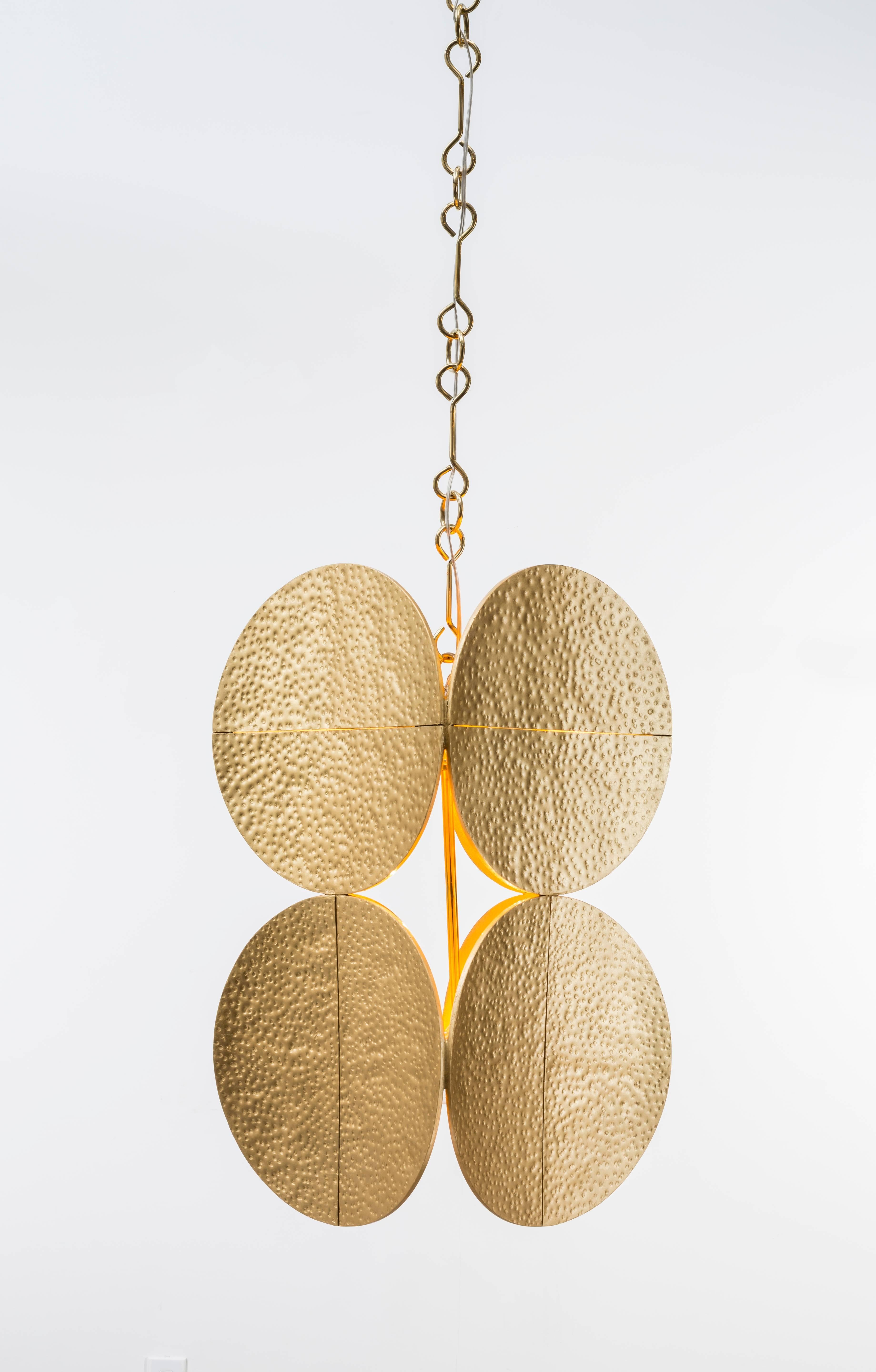 HALO PENDANT - Modern Gold Leaf Chandelier with Brass Chain

The Halo Chandelier is a stunning piece of functional art that will add a touch of elegance and sophistication to any interior. It features gold leaf Halo's suspended from a decorative
