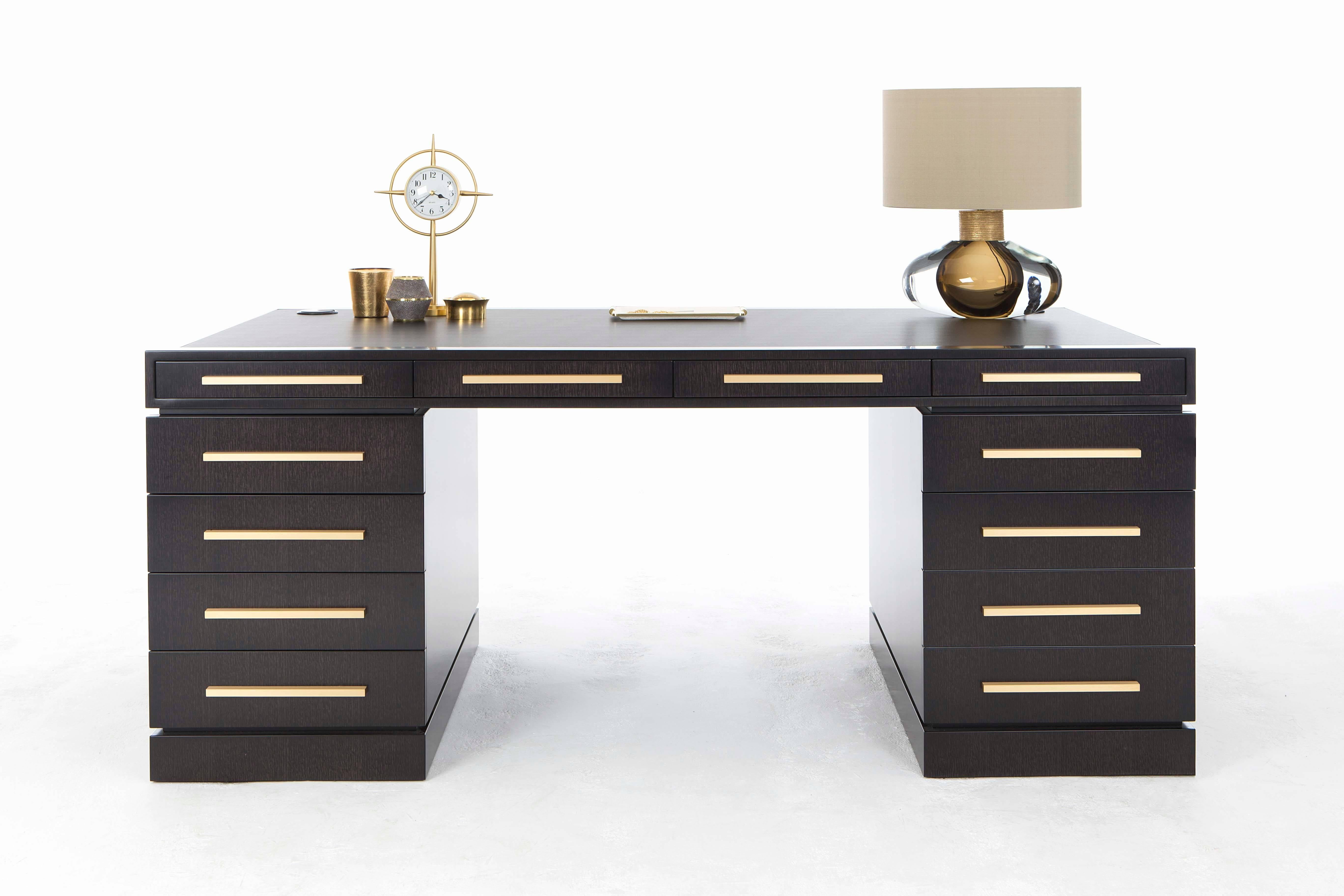 An ultra-glamorous writing desk finished in satin dark tinted oak with handles finished in brushed brass.

Be bold with this smart writing desk with an inset leather writing surface and ample storage to house all those office essentials. The left