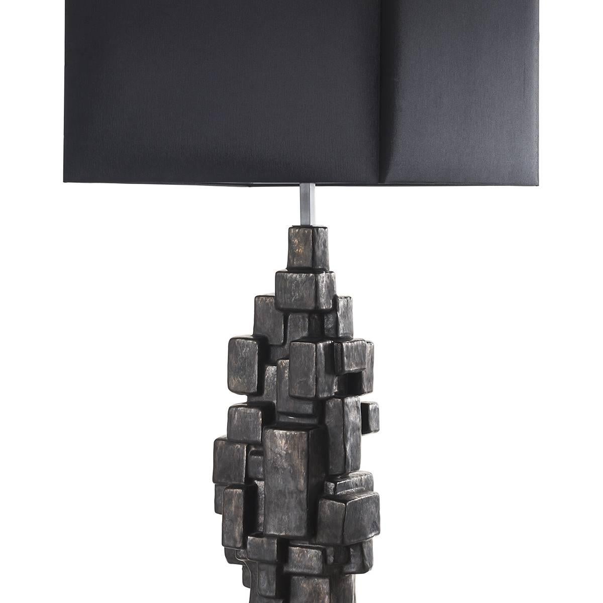 Sculptural ceramic table lamps with shades.
Superb way to glam up the space. This ceramic is skillfully glazed in a lead finish for an idealist mood. The lamps are complemented by square black fabric shades. Wired to your request, 1 x E27/E26 screw