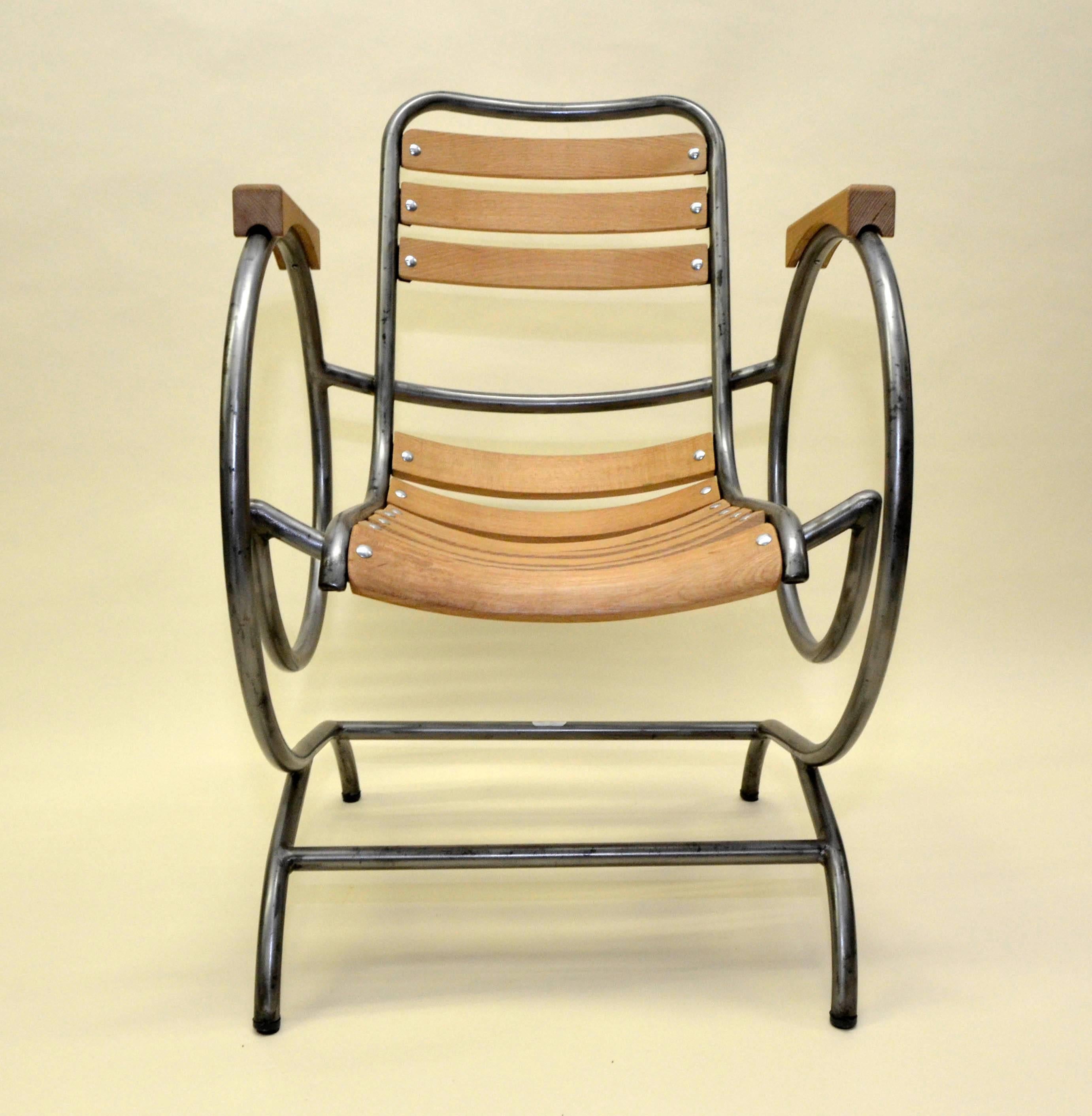 Very rare Flexi-Tube armchair also known as 'escargot' for the typical curved tubular sides. Originally conceived as garden armchair was designed in the 1950s by Lucien Illy in Nyons, in the southeastern France Drôme department. The Flexi-Tube