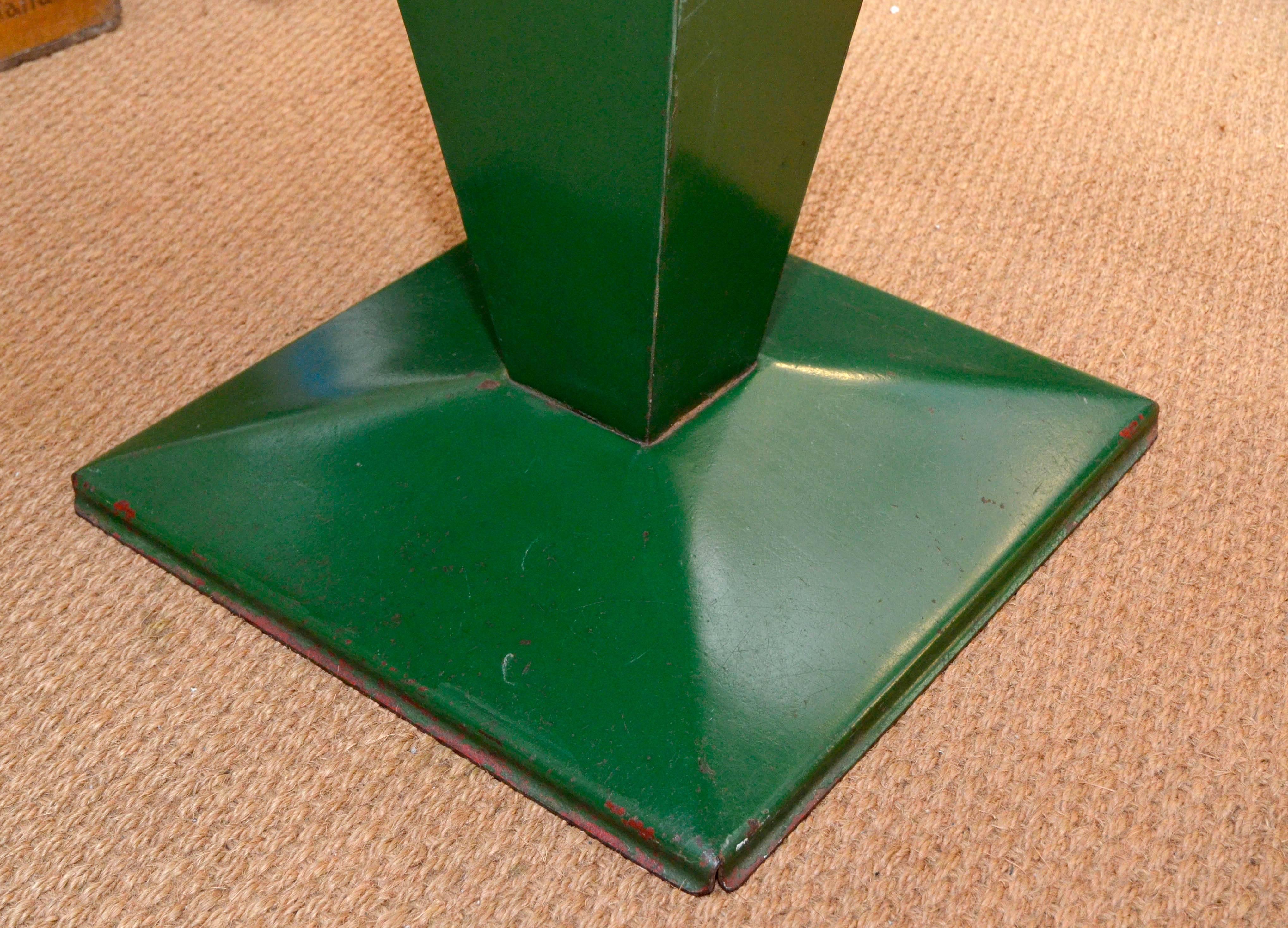 This rectangular Tolix green table is extremely rare. The squared base is in fact a typical feature that always characterizes the squared structure of the bistro table known as 'Cube' (commonly found in 80 x 80cm or 90 x 90cm, often with a hole at