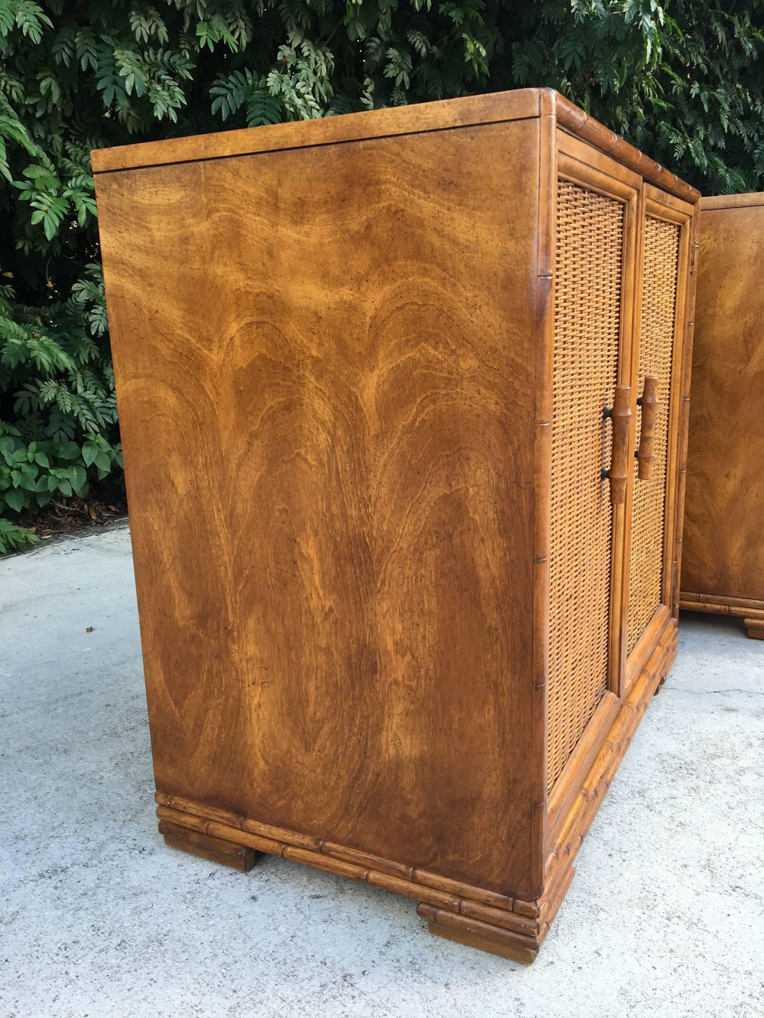 Pair of matching rattan cabinets featuring bamboo handles and trim. Large storage area with adjustable shelf. From Palm Beach to Boho, these would compliment any style decor. Could be used as nightstands as well. Excellent vintage condition.