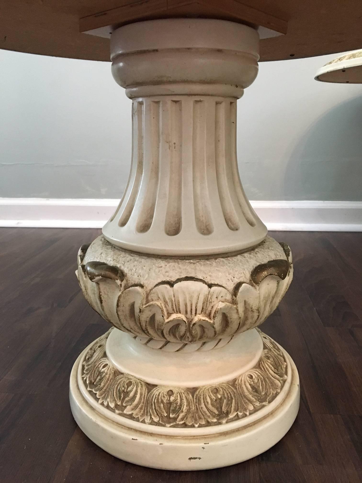 Pair of Italian style column side tables feature marbled glass tops and carved detailing. Perfect for your Hollywood Regency decor. Very good vintage condition.