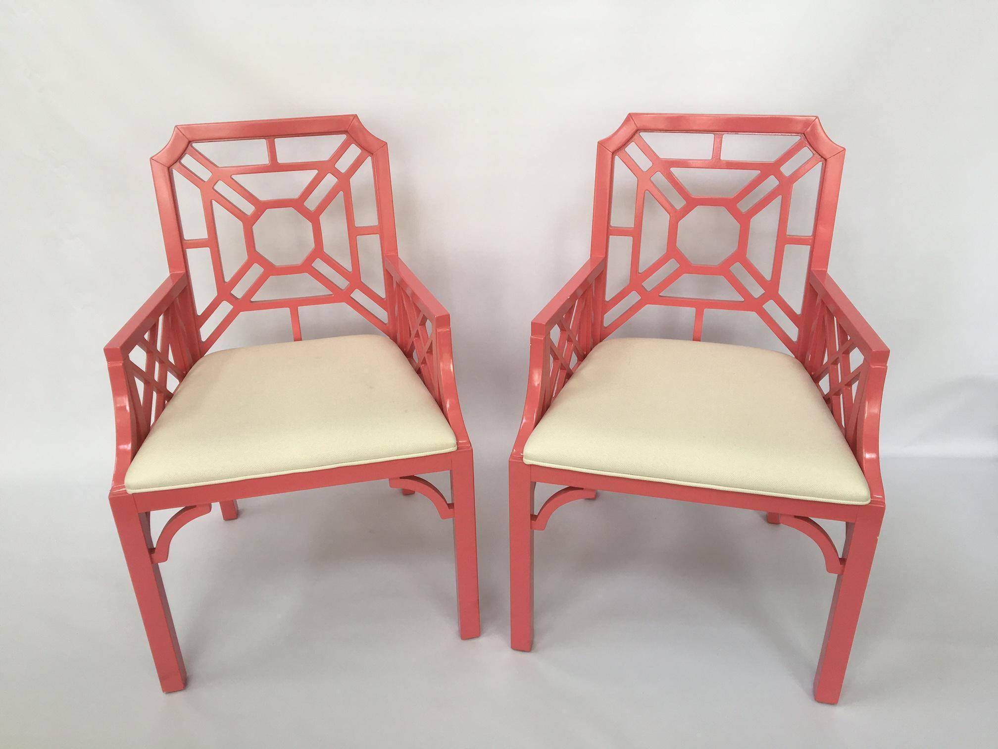 Chinoiserie style Chippendale chairs by Lilly Pulitzer Home in vibrant pink lacquer finish with solid crème upholstery. Excellent as-found condition, some tiny imperfections to finish.
