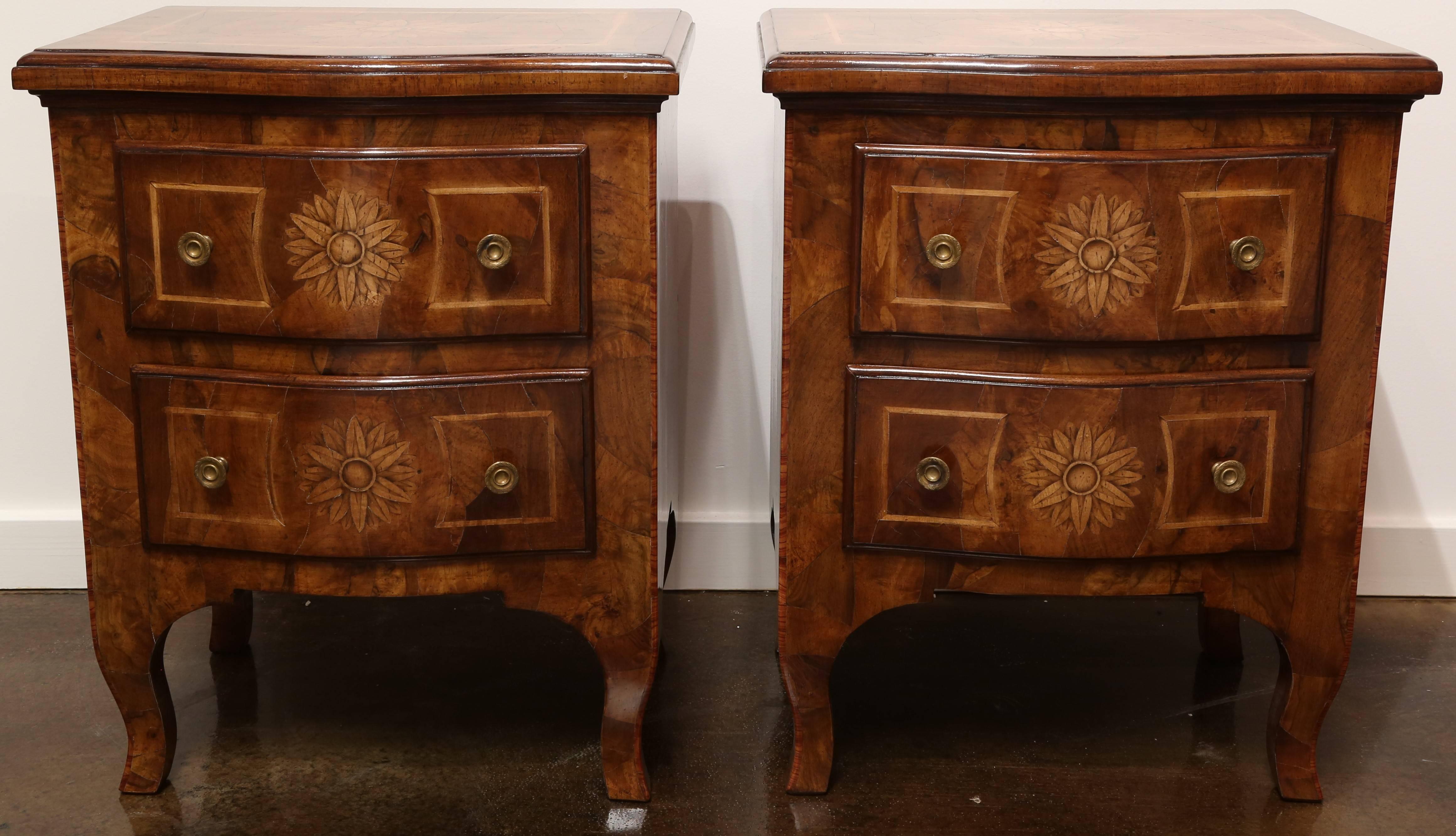 Pair of Italian walnut shaped chest of drawers featuring two drawers, walnut oyster wood styling and hand-carved inlays of Maple and Rosewood, with a hand rubbed old world finish, Italy.