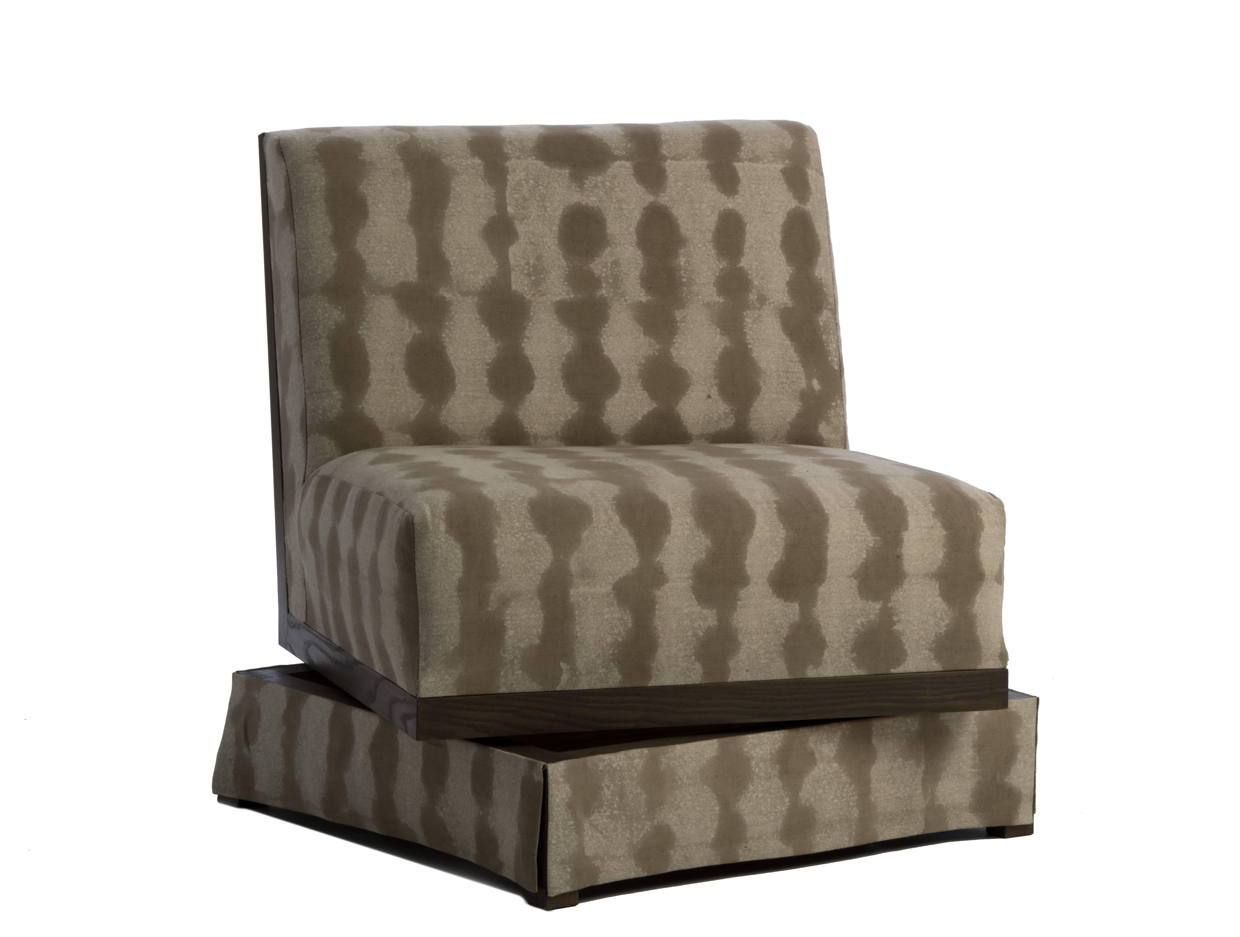 Designed by Ashley Yeates, handmade in the United States, a maximized seat space with open comfort, the armless swivel highlights North American ashwood details on the seat back and is the perfect complement to traditional and contemporary spaces