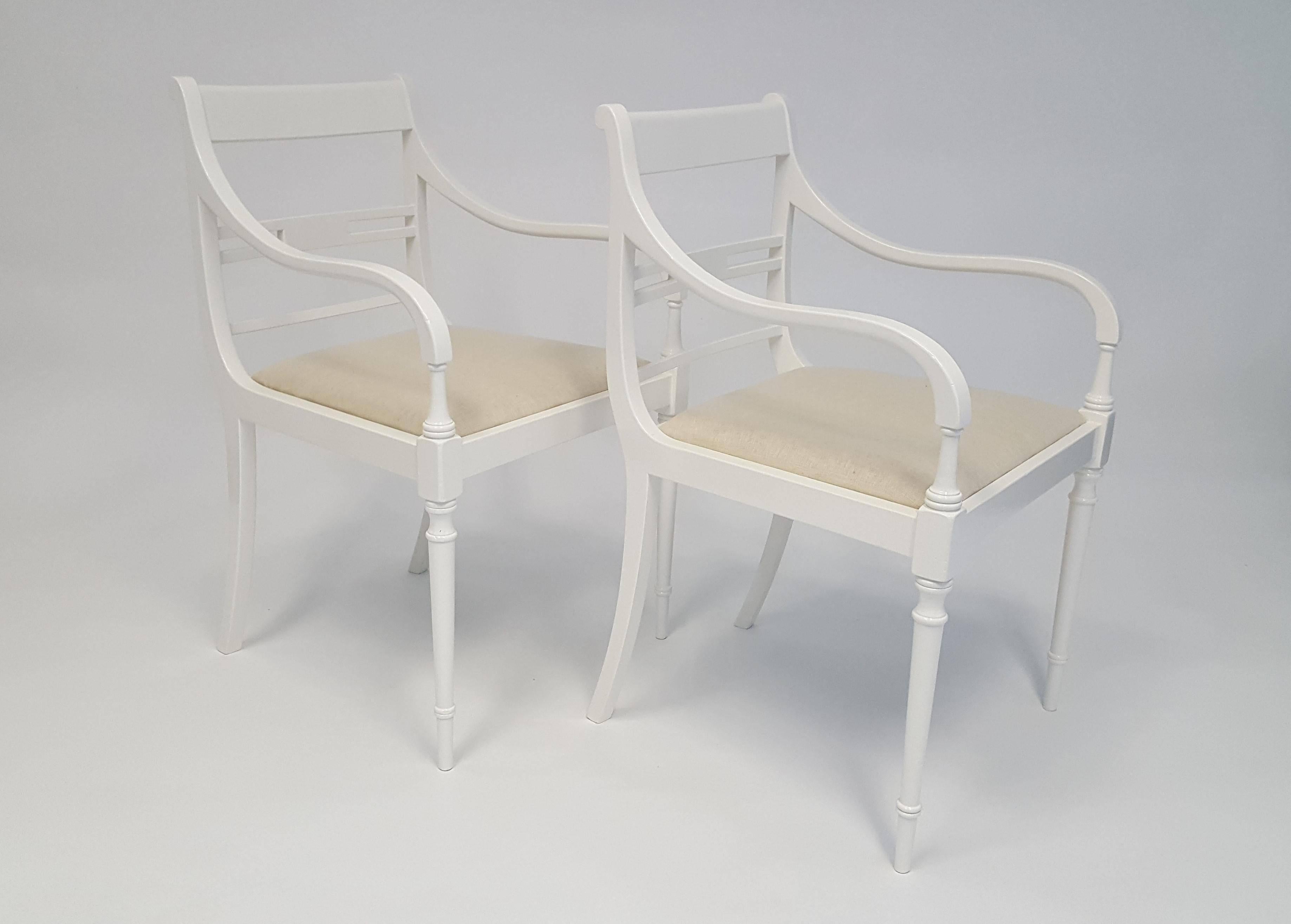 8 Armchairs are available!  Sold in pairs.  Gorgeous vintage Regency style armchairs that have been newly and professionally lacquered in Alabaster White.  Lovely and elegant lines.  Slip in seats make for easy recovering in your own fabric, which