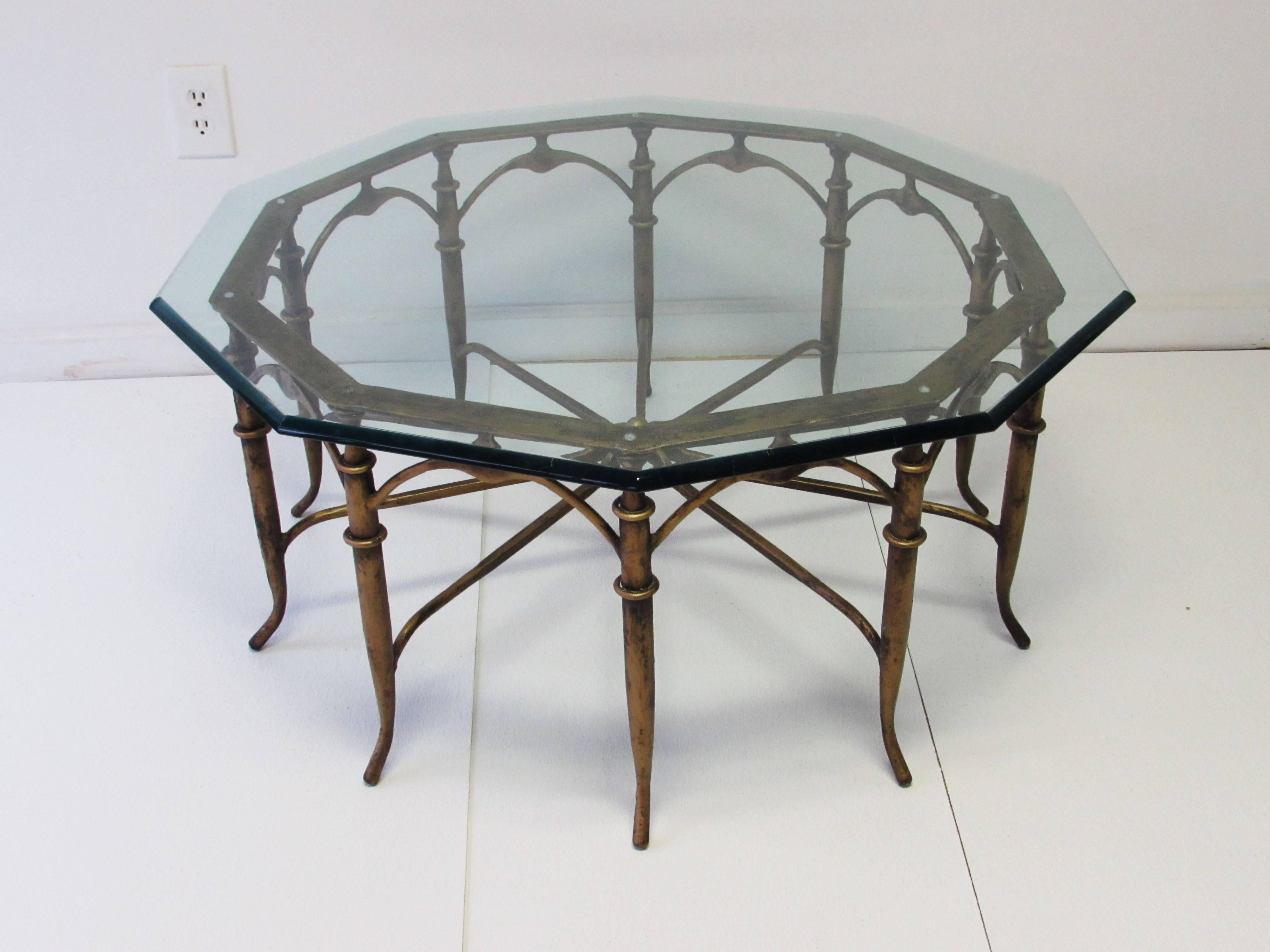 Italian spider leg coffee table with 10-sided glass top in the style of Carlo Di Carli. Original patina. Top, 36