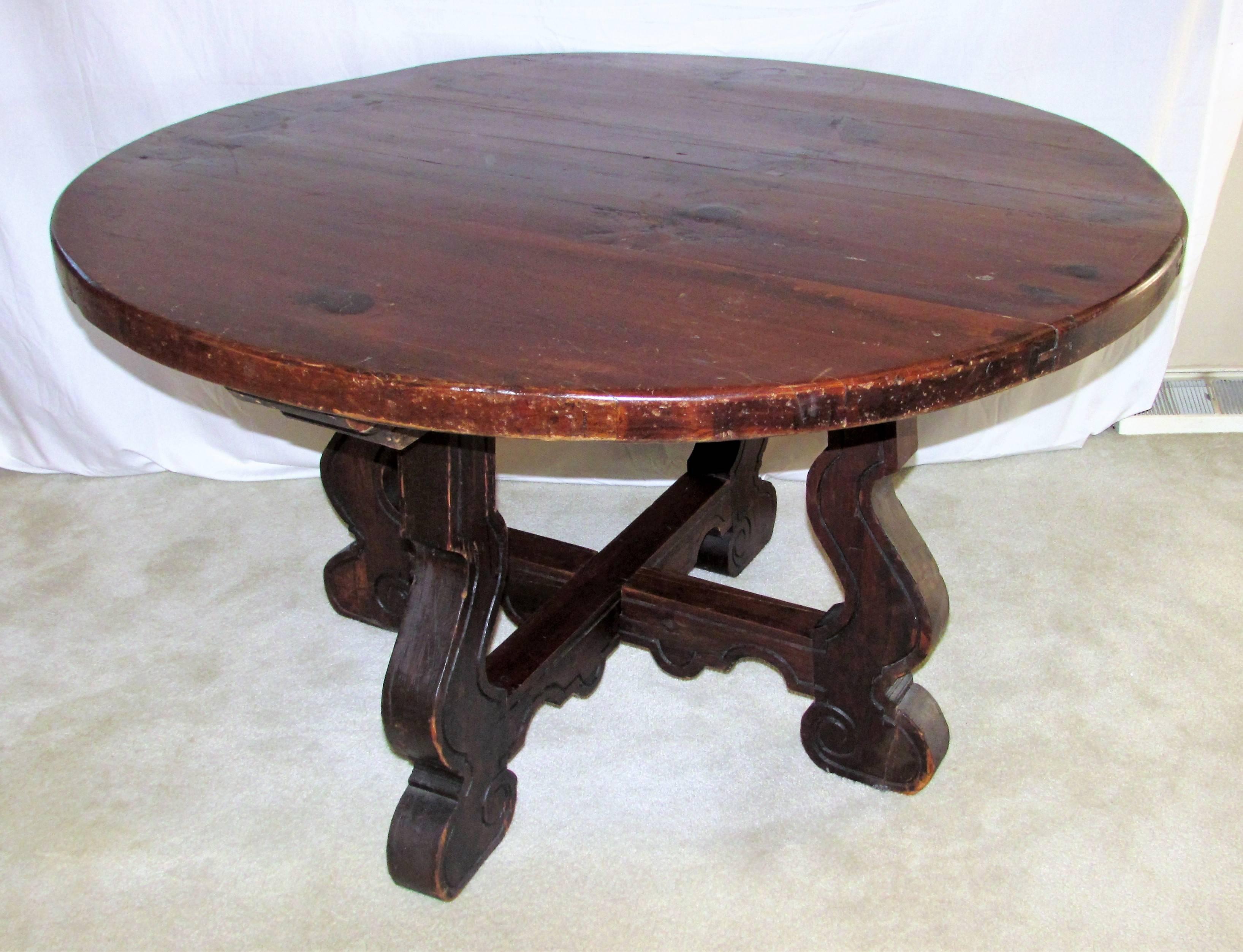 This antique Catalan style table is from the 1800s to the turn of the century. It has a wonderful thick, rustic, pine wood top. Catalan style tables were originally made to be disassembled easily due to the war in the Middle Ages, when nobility