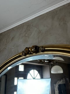 20th Century French Oval Giltwood and Stucco Mirror with Floral Decoration