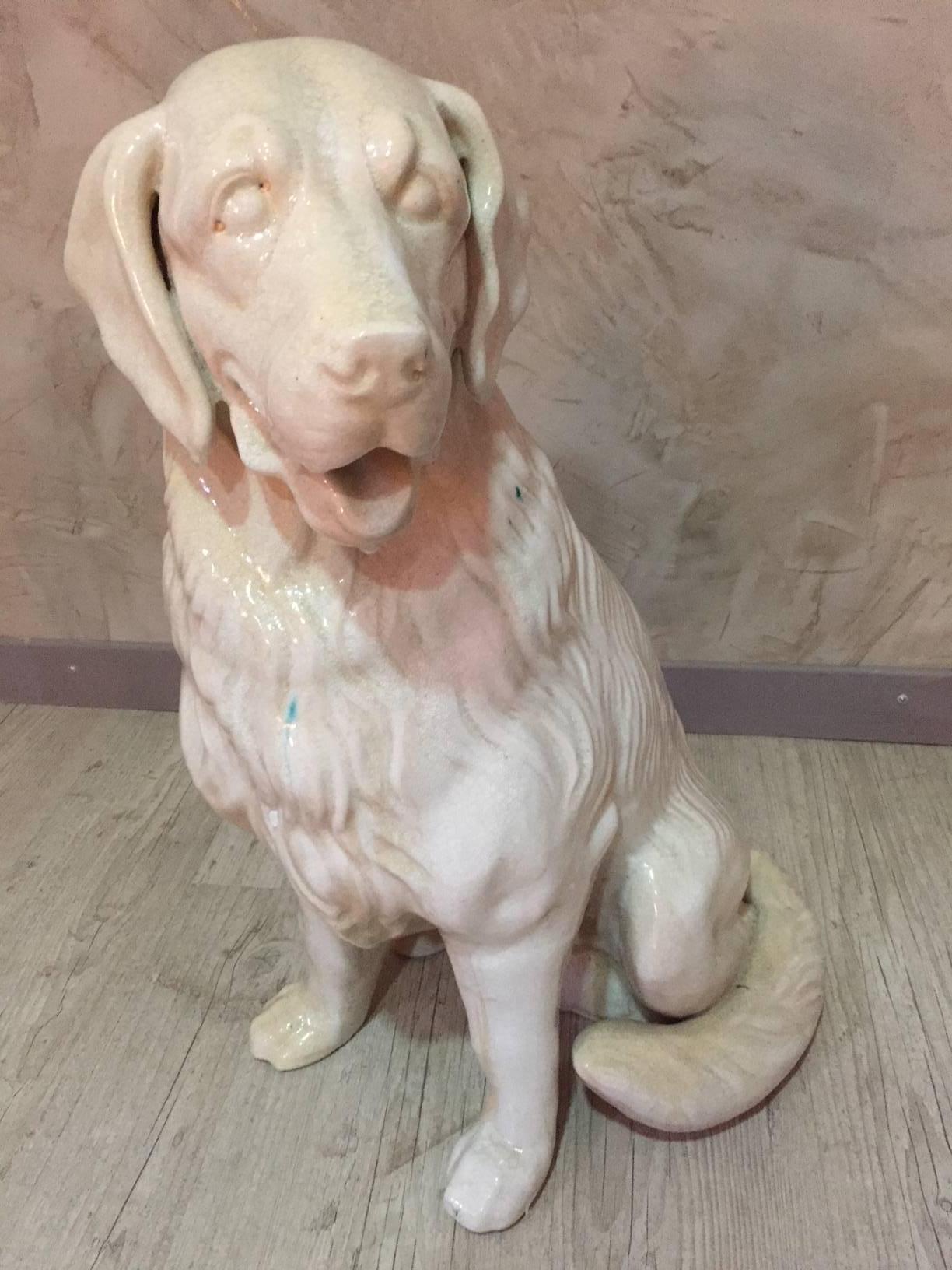 Midcentury French ceramic dog from Vallauris.
Vallauris is a small town in the south of France where the ceramic atelier and manufactures are well represented for their good quality.
The dog is a type of Golden retriever.
The are some green marks