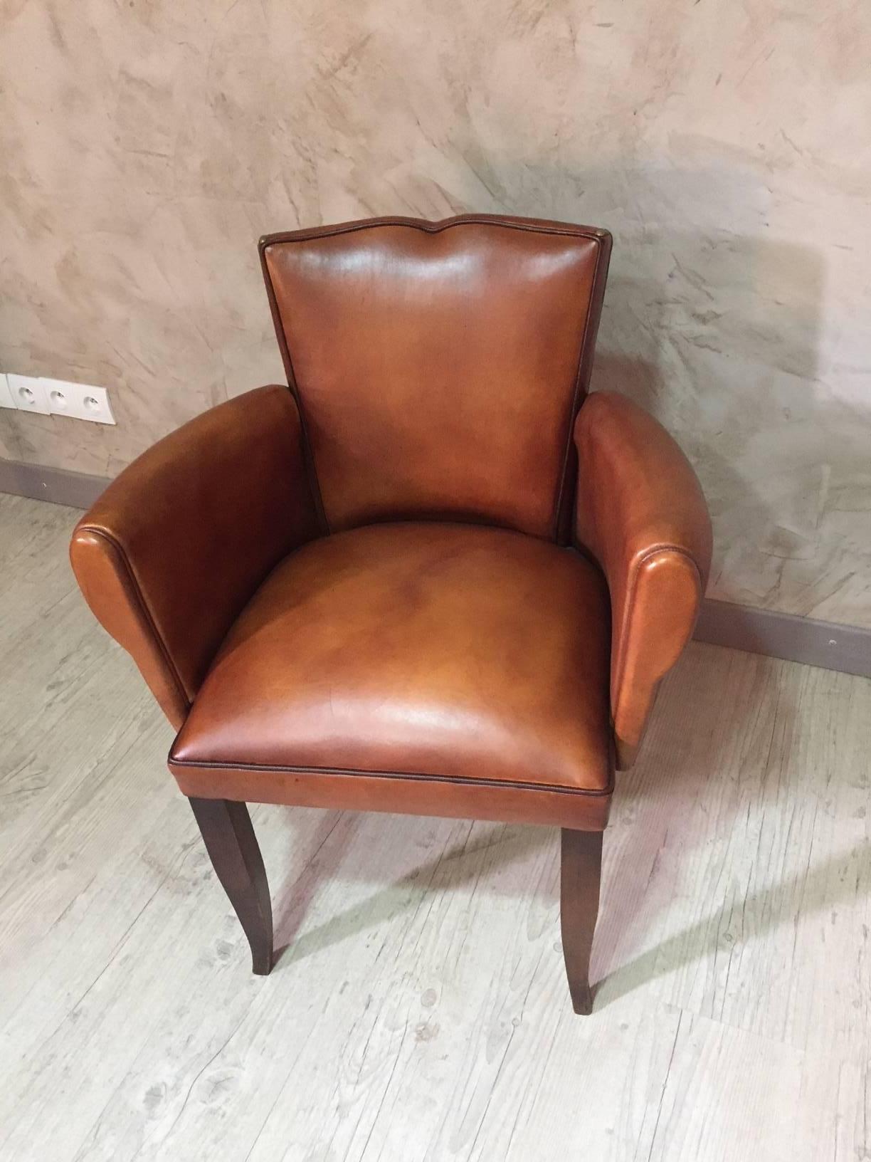 Moustache bridge armchair fully restored with a good quality patinated leather and braid finish. This armchair would be ideal for an office. It called 