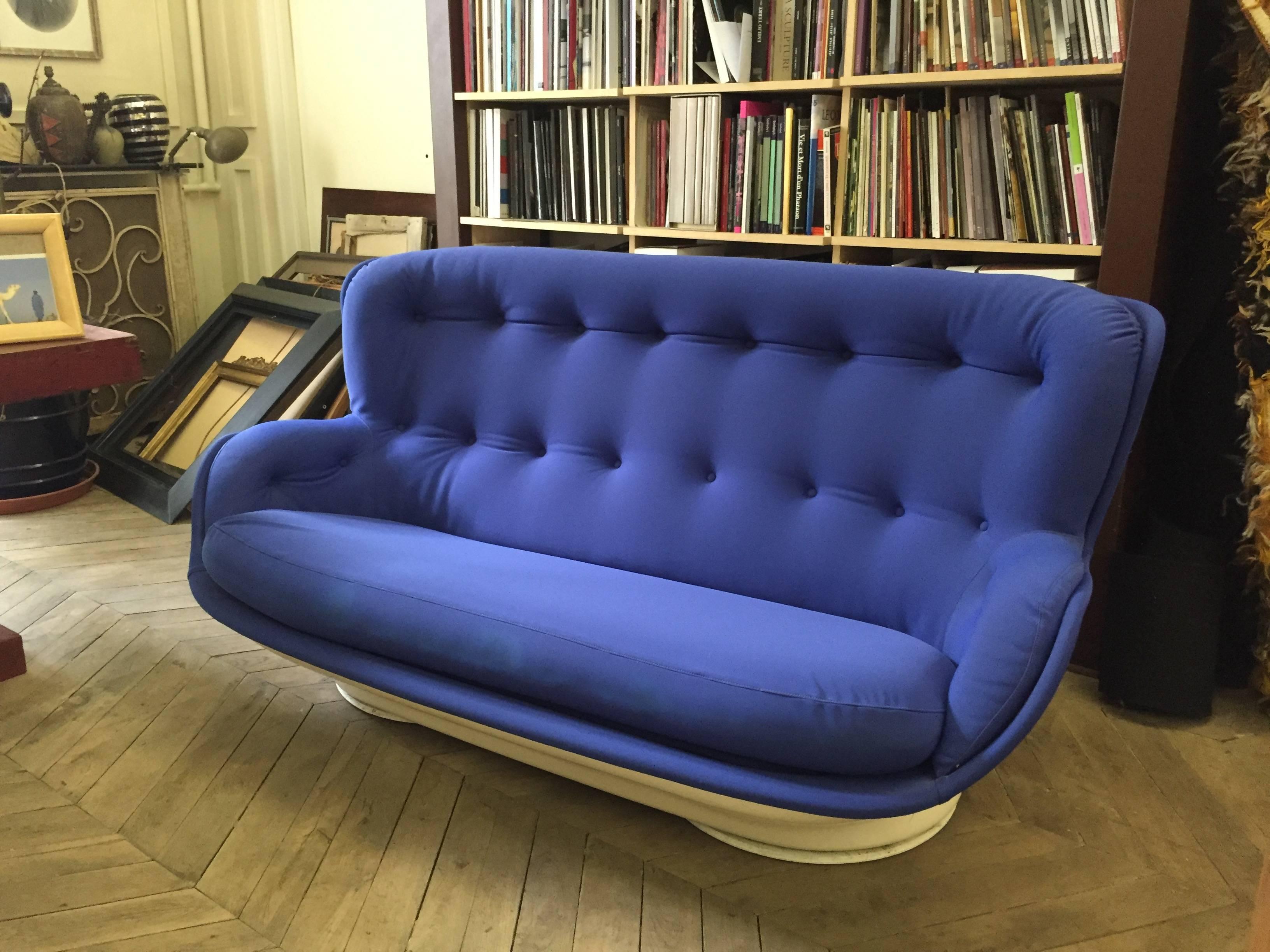 Impressive and original blue sofa. This sofa was produced in 1968 by Airborne International France, after a design by Michel Cadestin. The white Fiberglass hull is upholstered in blue fabric, and is very comfortable.