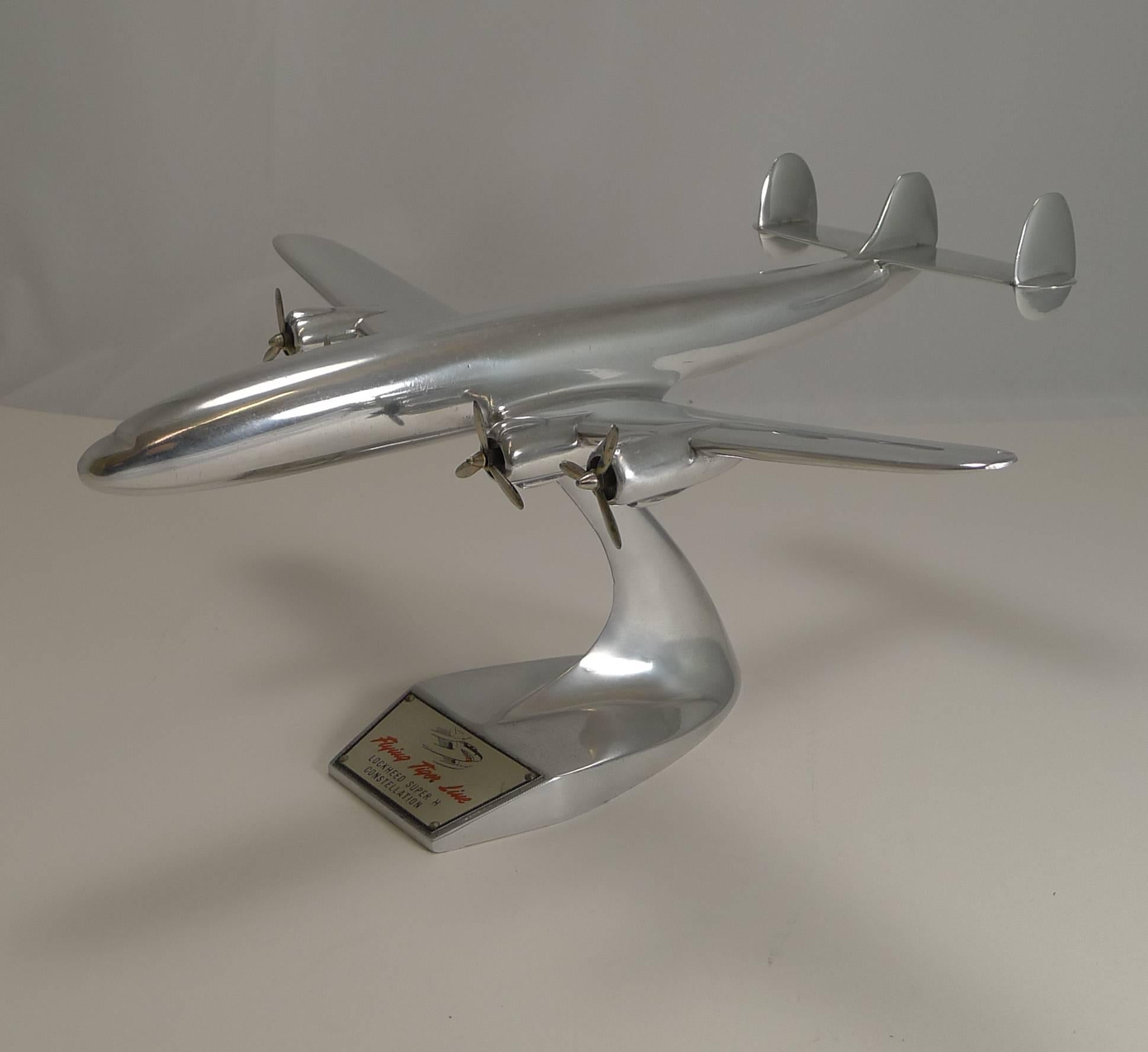 A handsome and highly collectable polished aluminium aircraft model on a detachable stand and retaining it's original label to the front.

The Lockheed Super H Constellation, airlifting 43,000 pounds of freight at 300 miles per hour over a